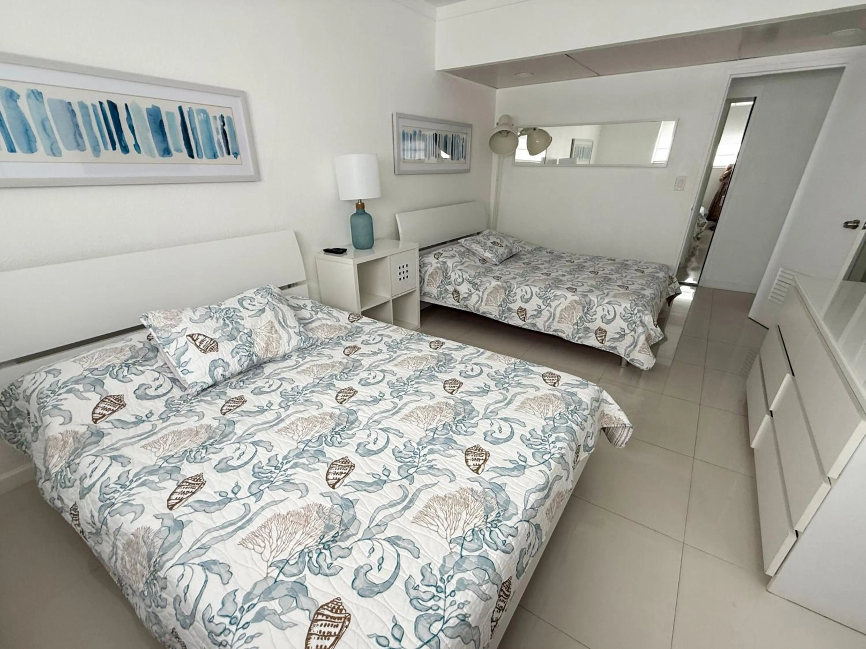 Bedroom, Bed in The Tides Apartments on the beach