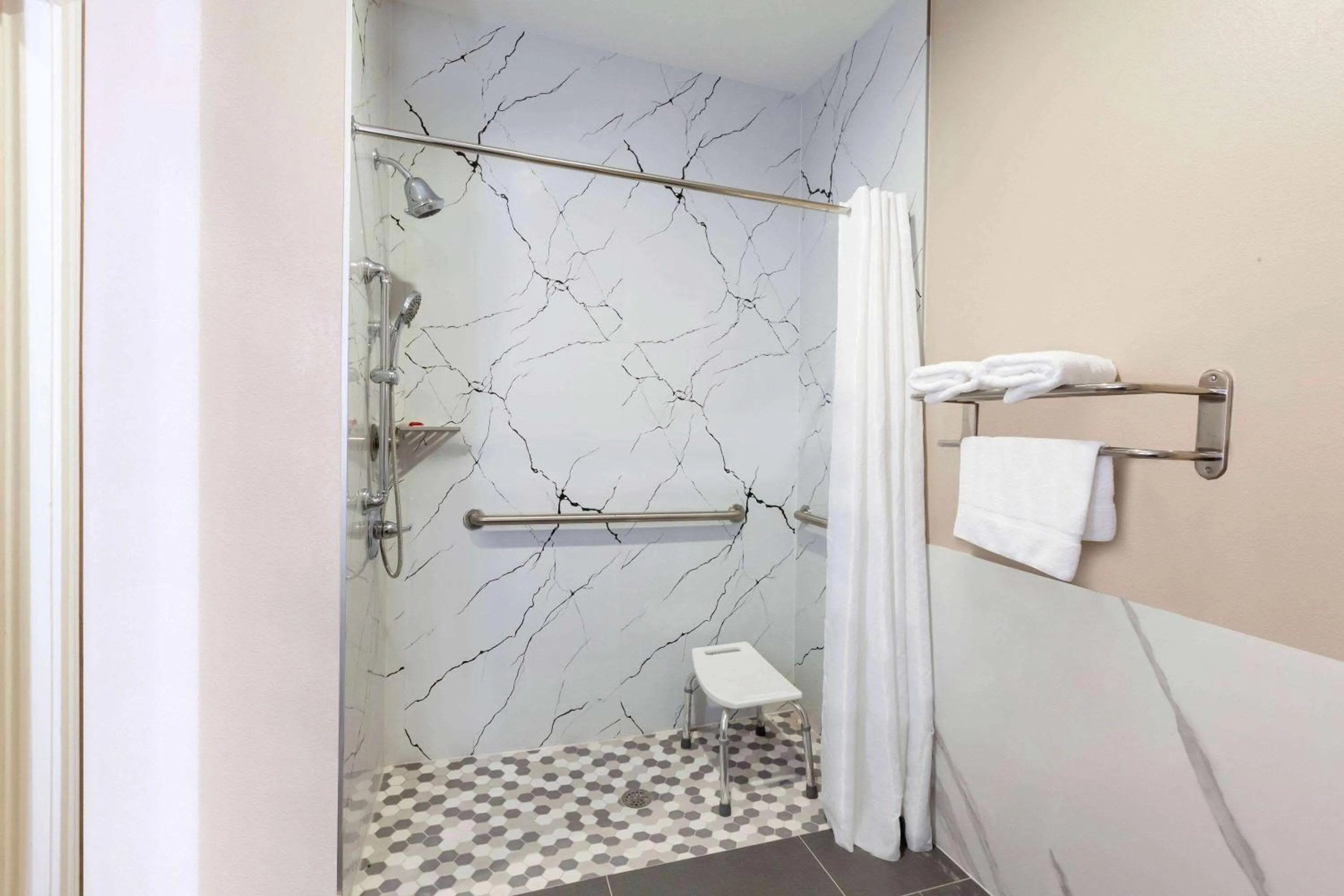 Shower in Super 8 by Wyndham Kingwood Houston North