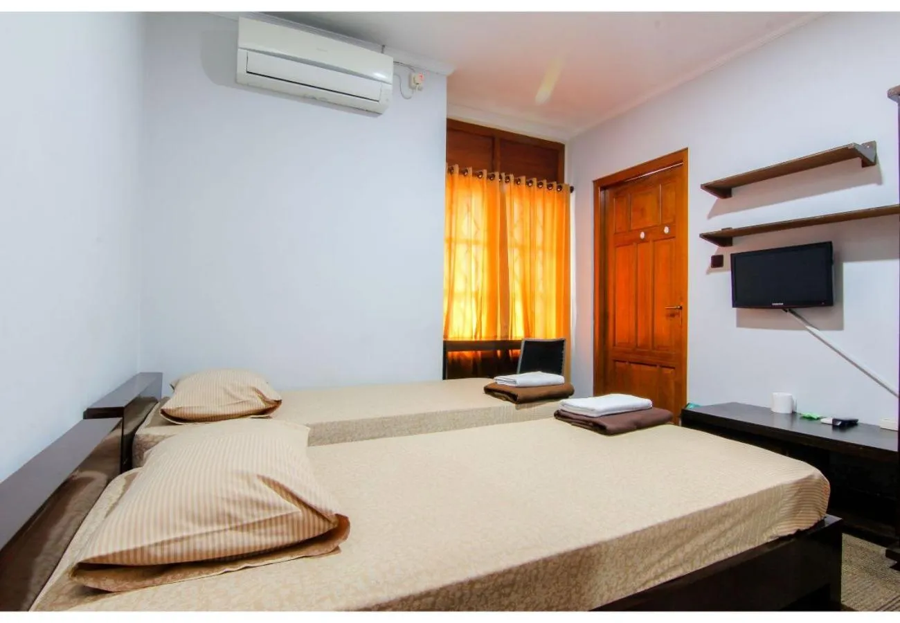 Photo of the whole room, Bed in Embe Enem Homestay