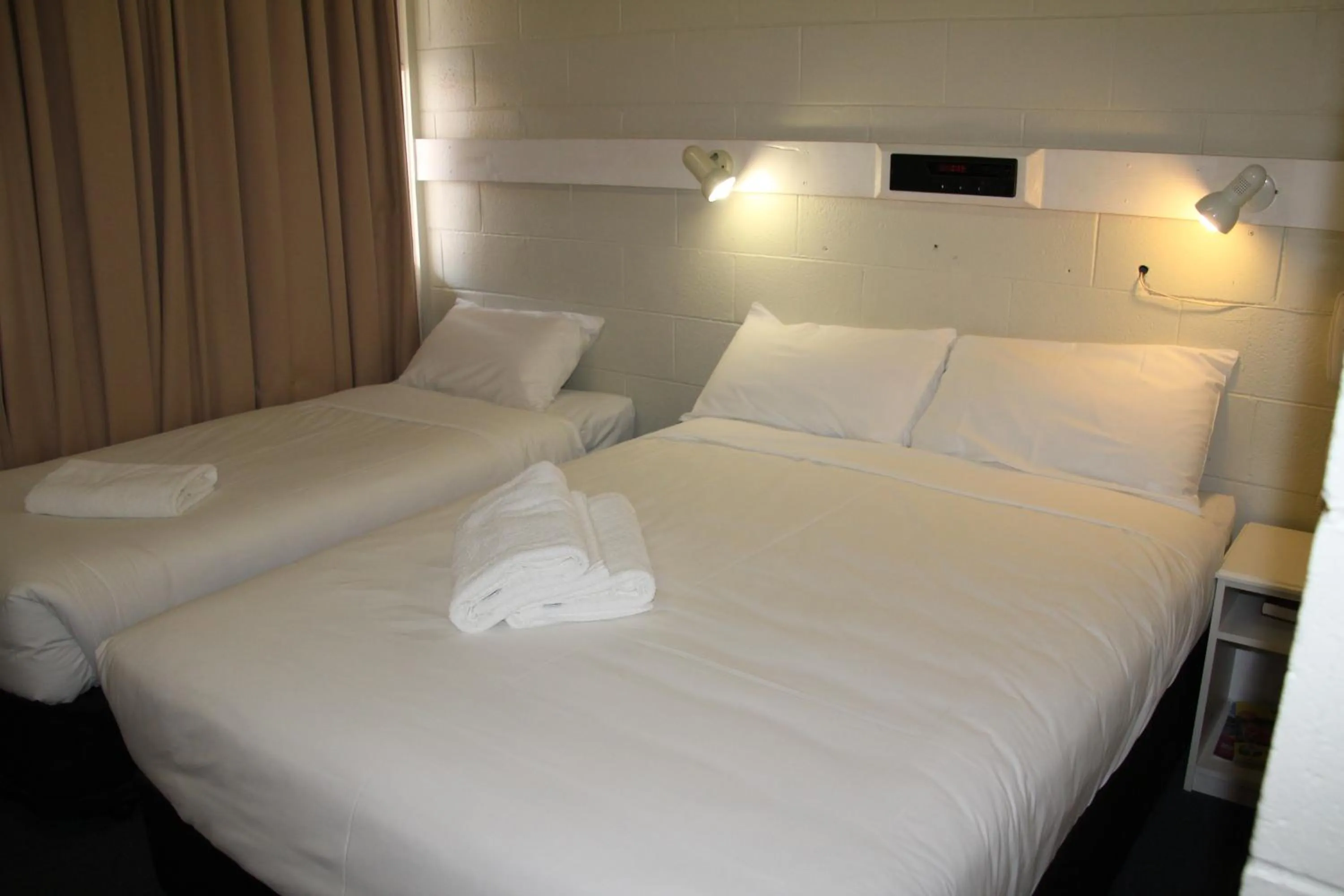 Bed in Central Coast Motel