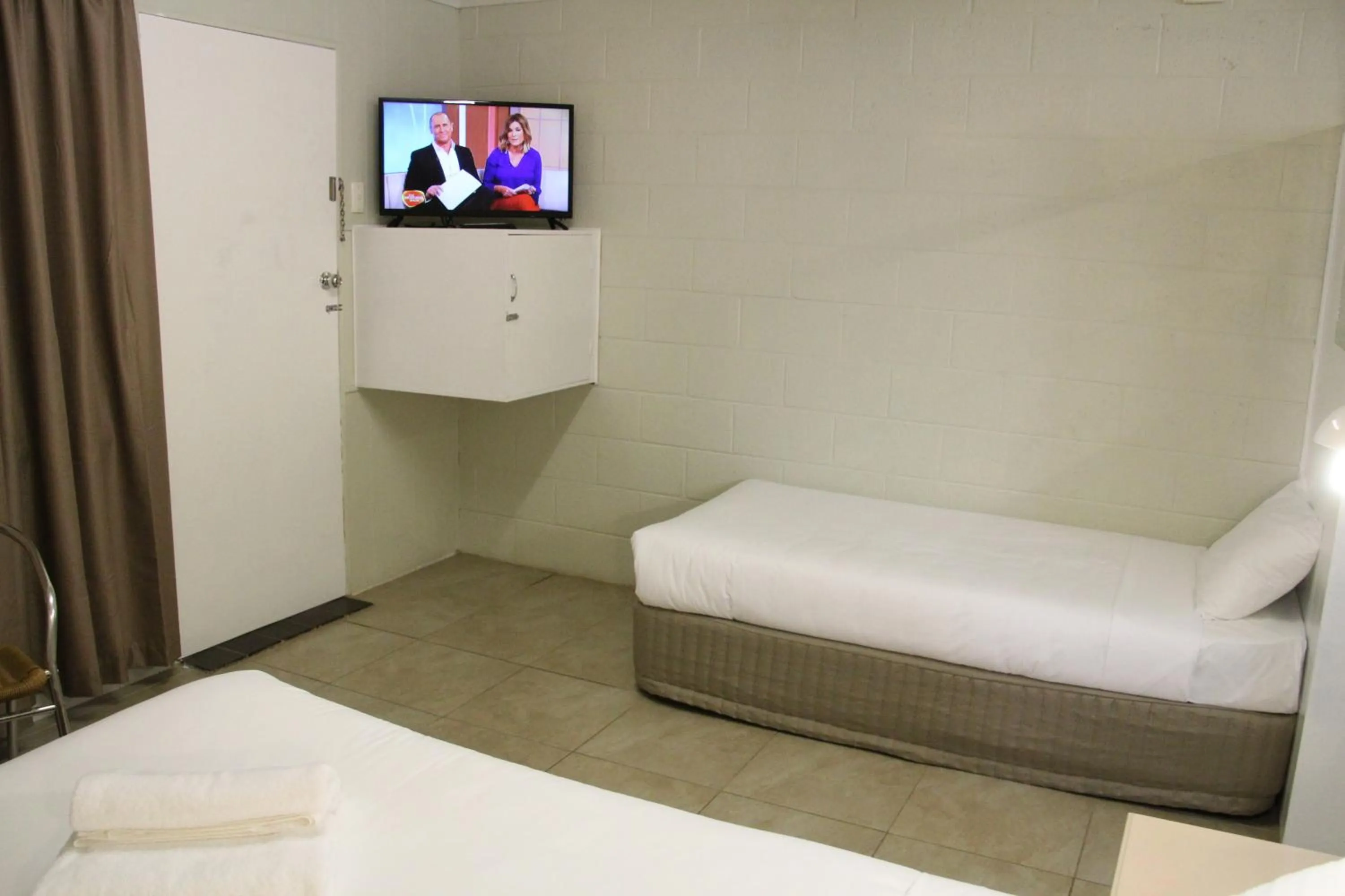 Bed in Central Coast Motel