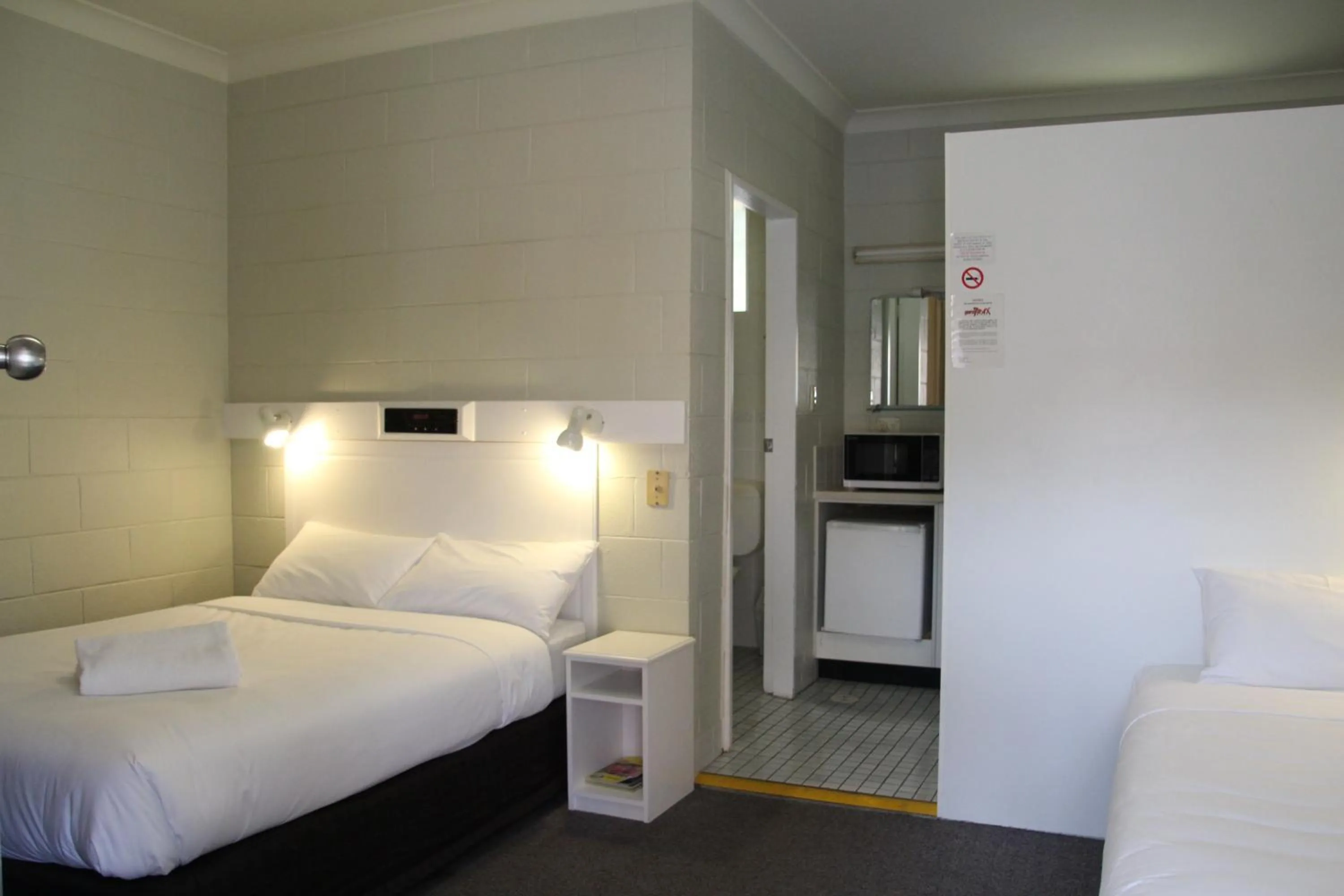 Bed in Central Coast Motel