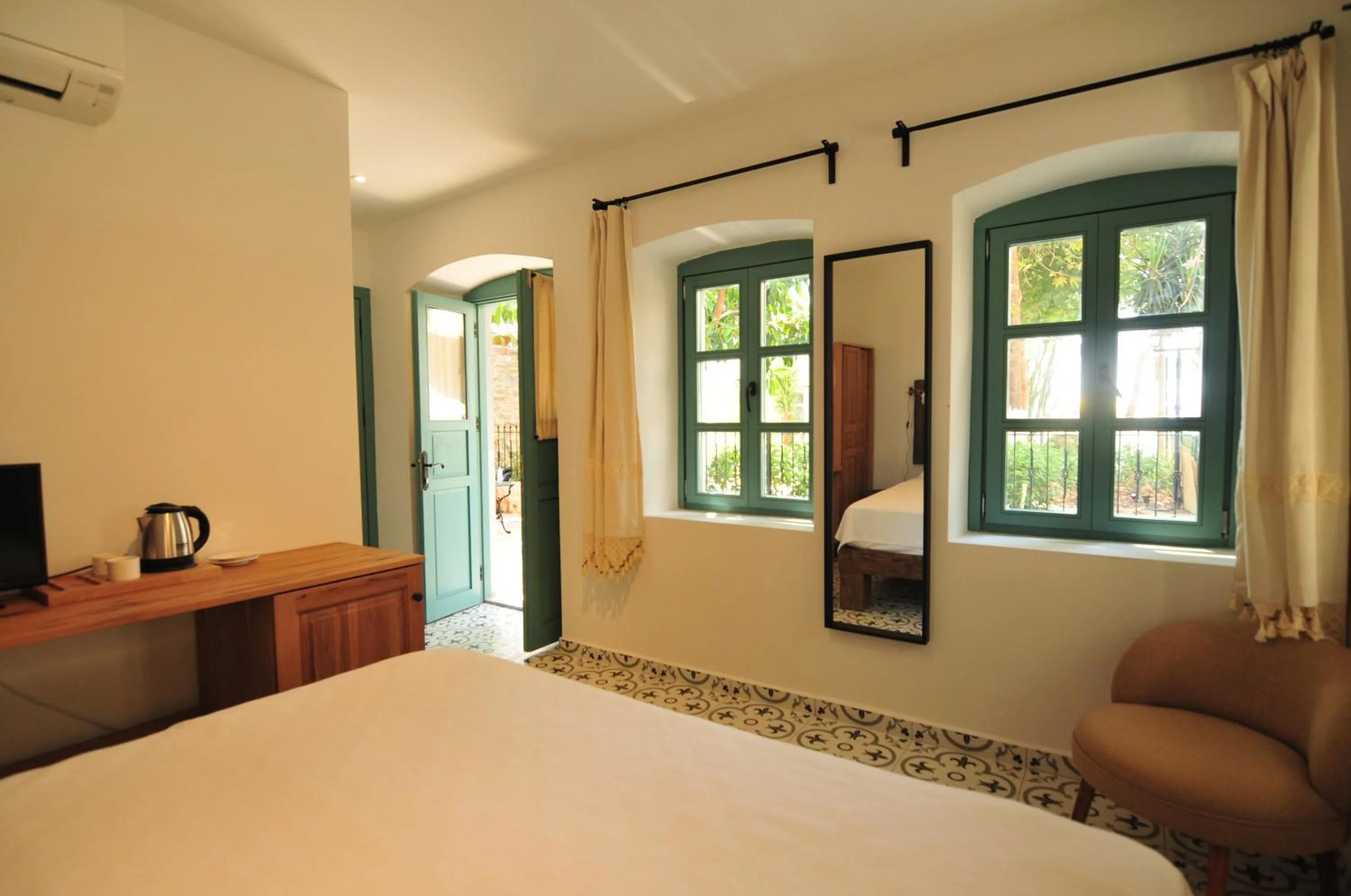 Bed in Oalis Boutique Hotel