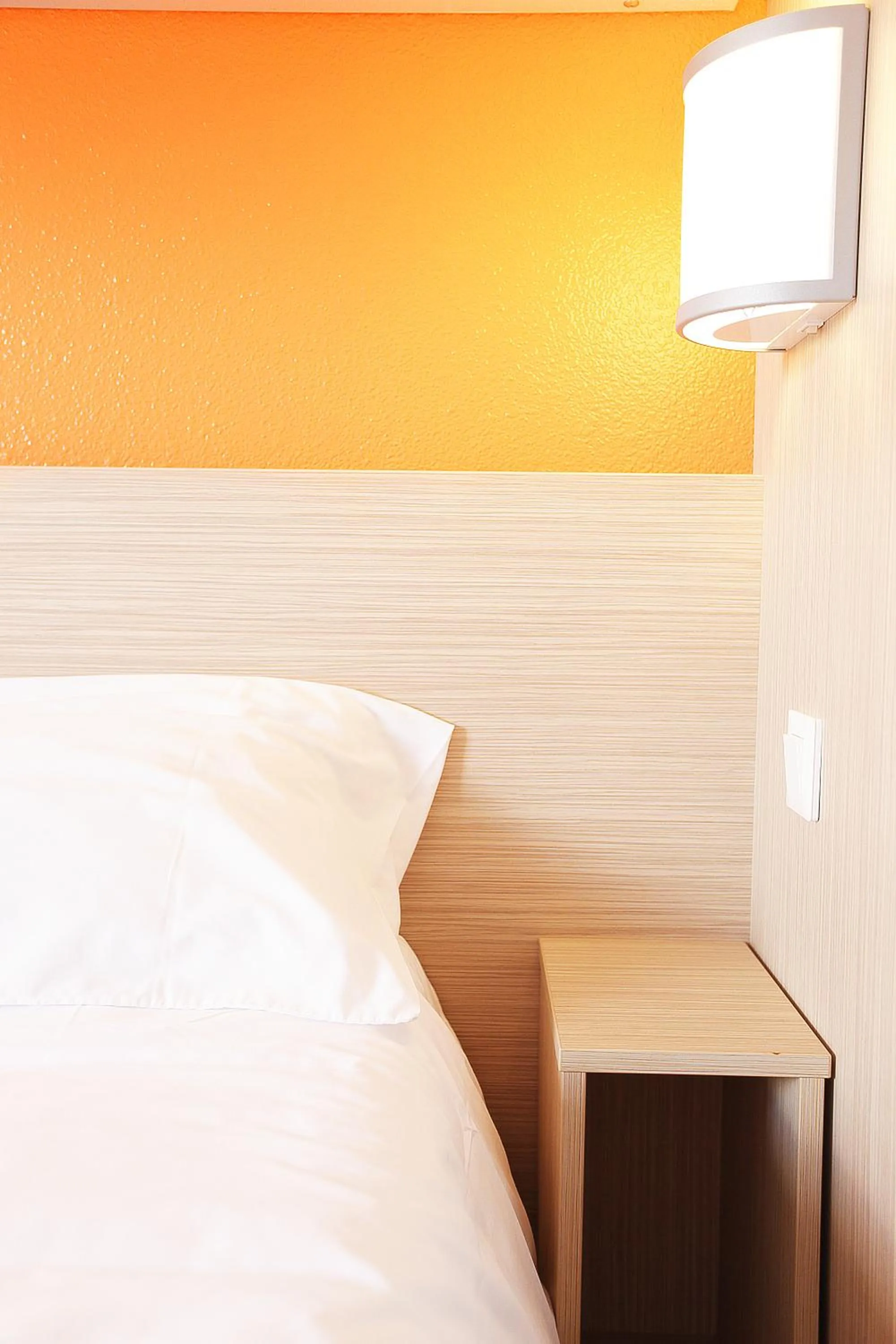 Decorative detail, Bed in Premiere Classe St Brieuc Tregueux