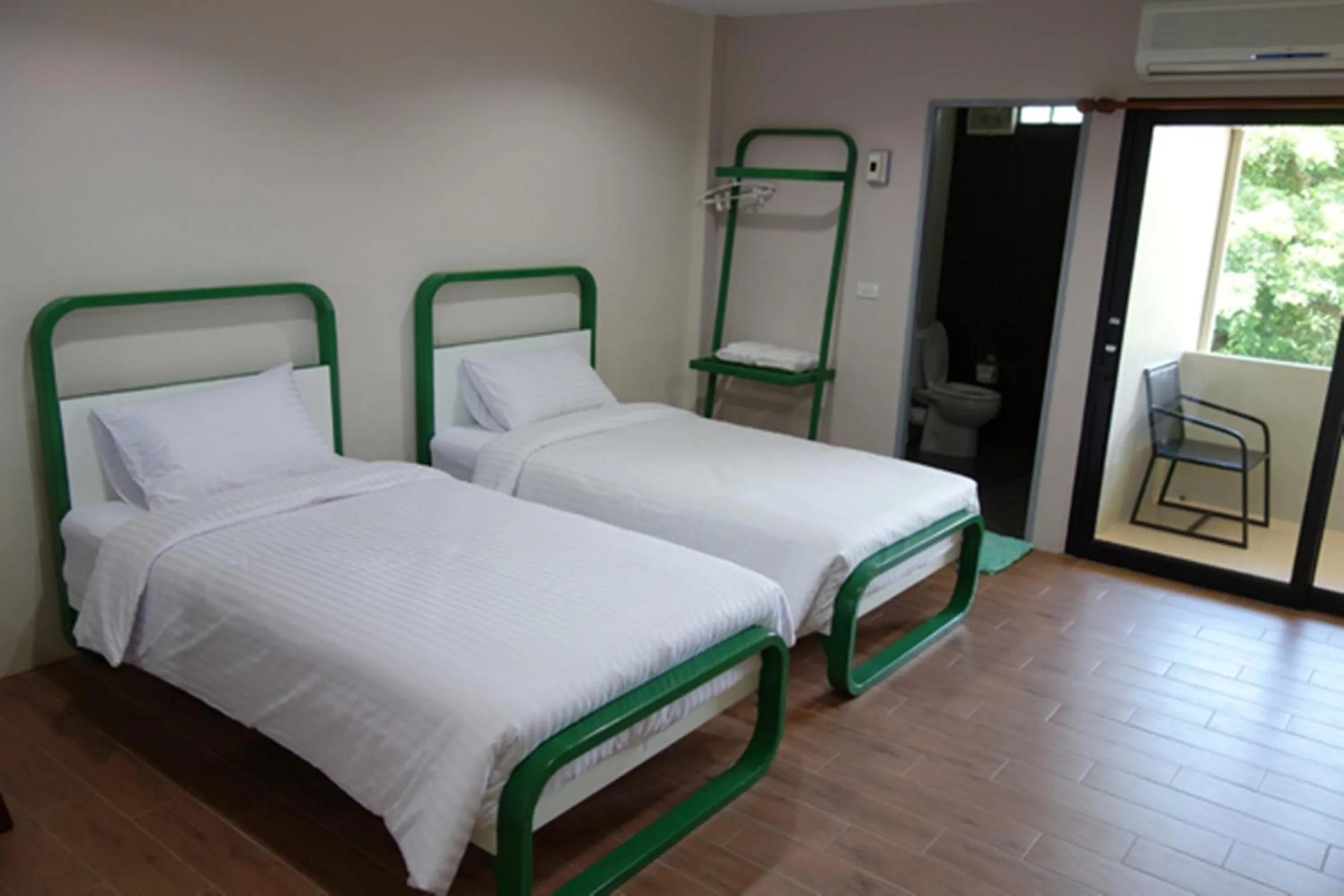 Bed in Sunshine Paradise Resort