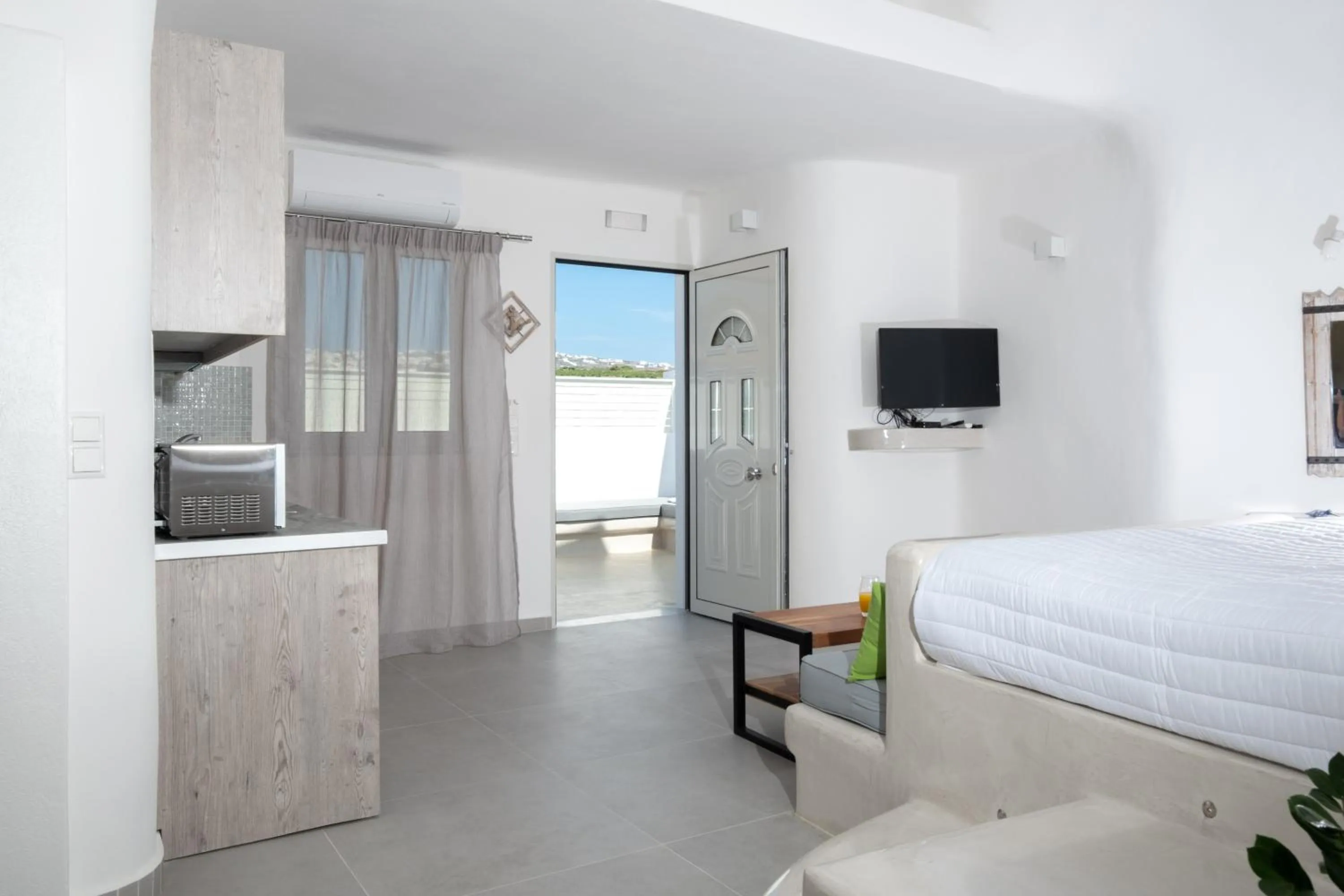 Bed in Santoterra Antigua Suites