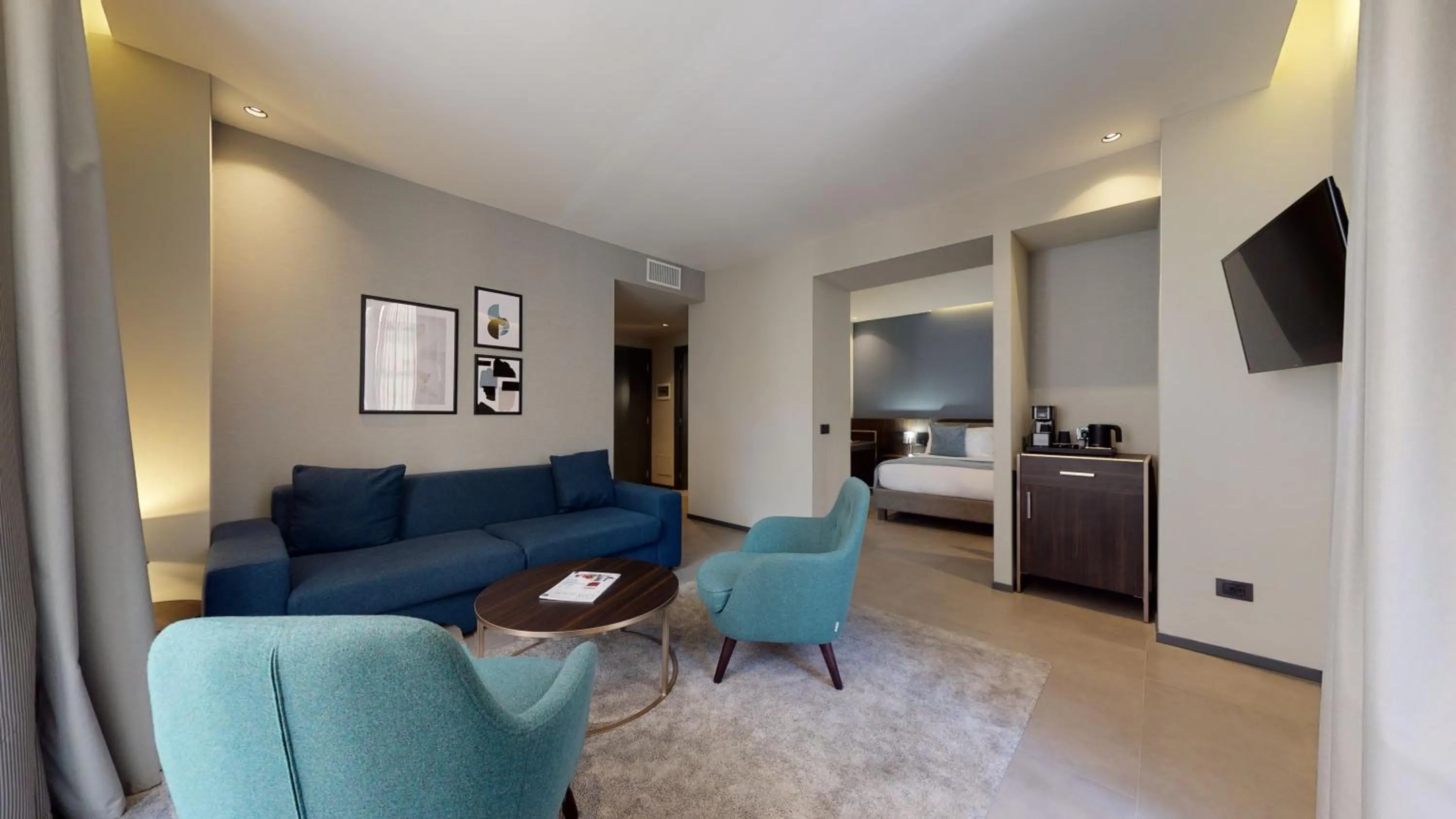Living room, Bed in GALLERIA The Smart Boutique APARTHOTEL By OSPITAMI