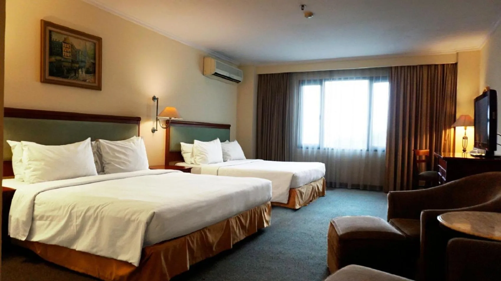 Photo of the whole room, Bed in Mega Anggrek Hotel Jakarta Slipi