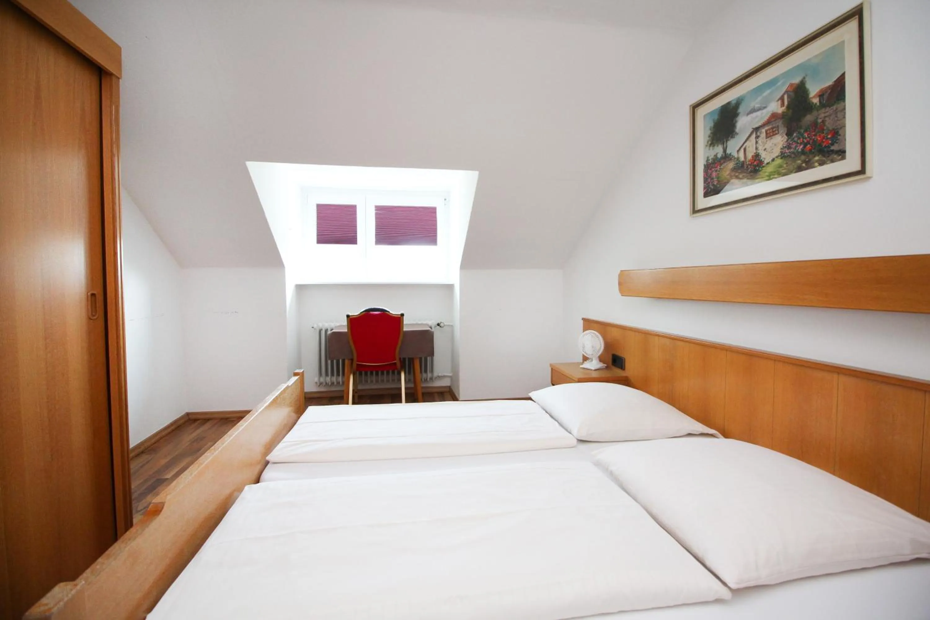 Bed in Hotel Olympia