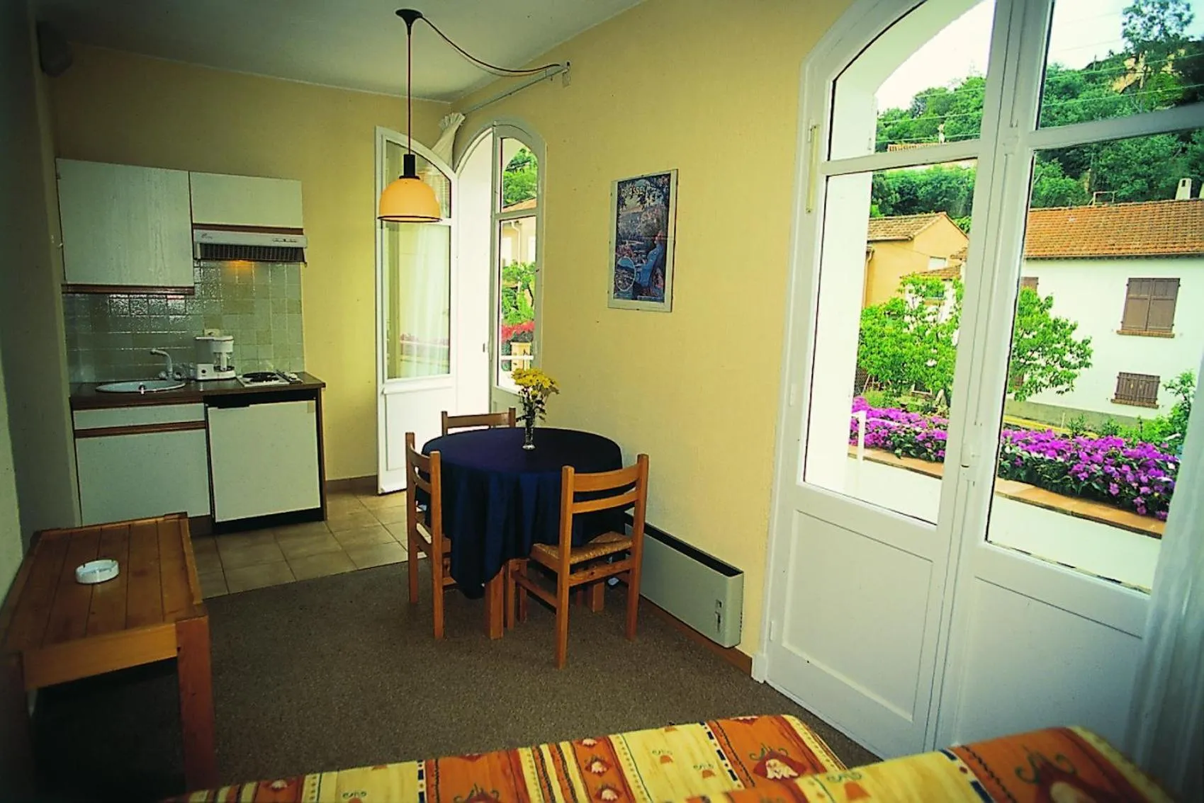 Kitchen or kitchenette in Hôtel Lou Paouvadou