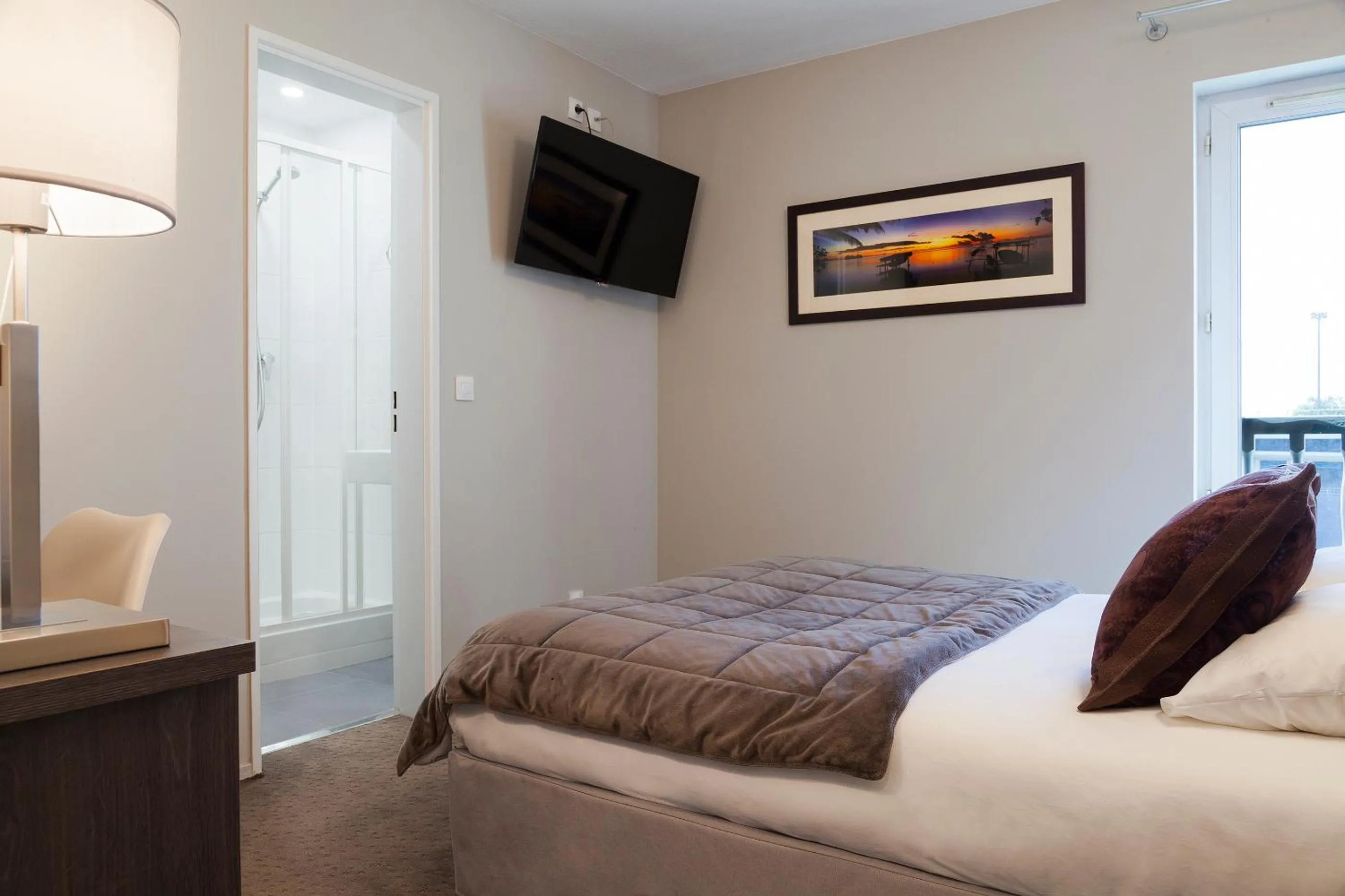 Bed in Hotel Acadie Les Ulis