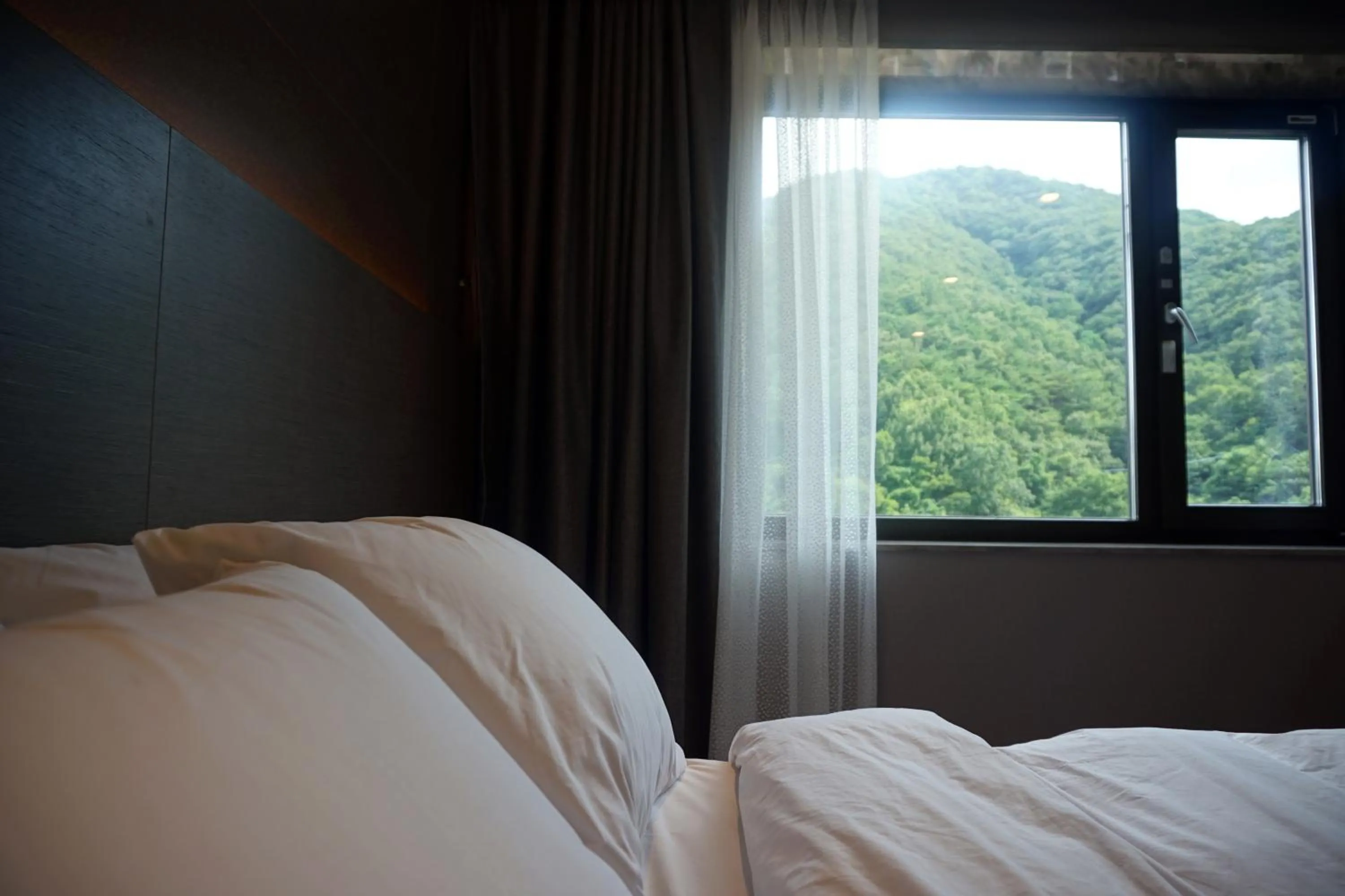 Bed in Mudeung Park Hotel