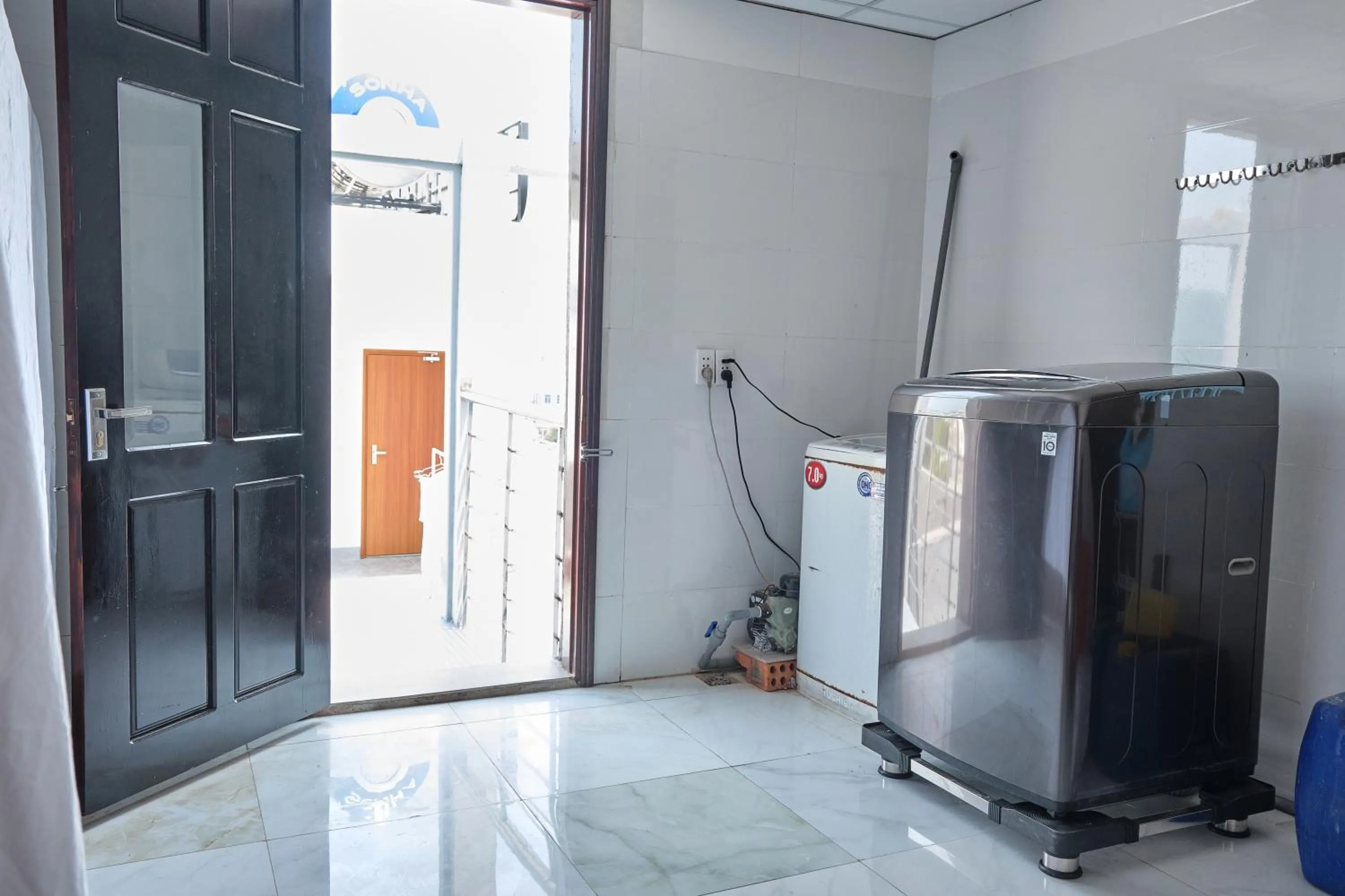 washing machine in Le House Hotel and Studio