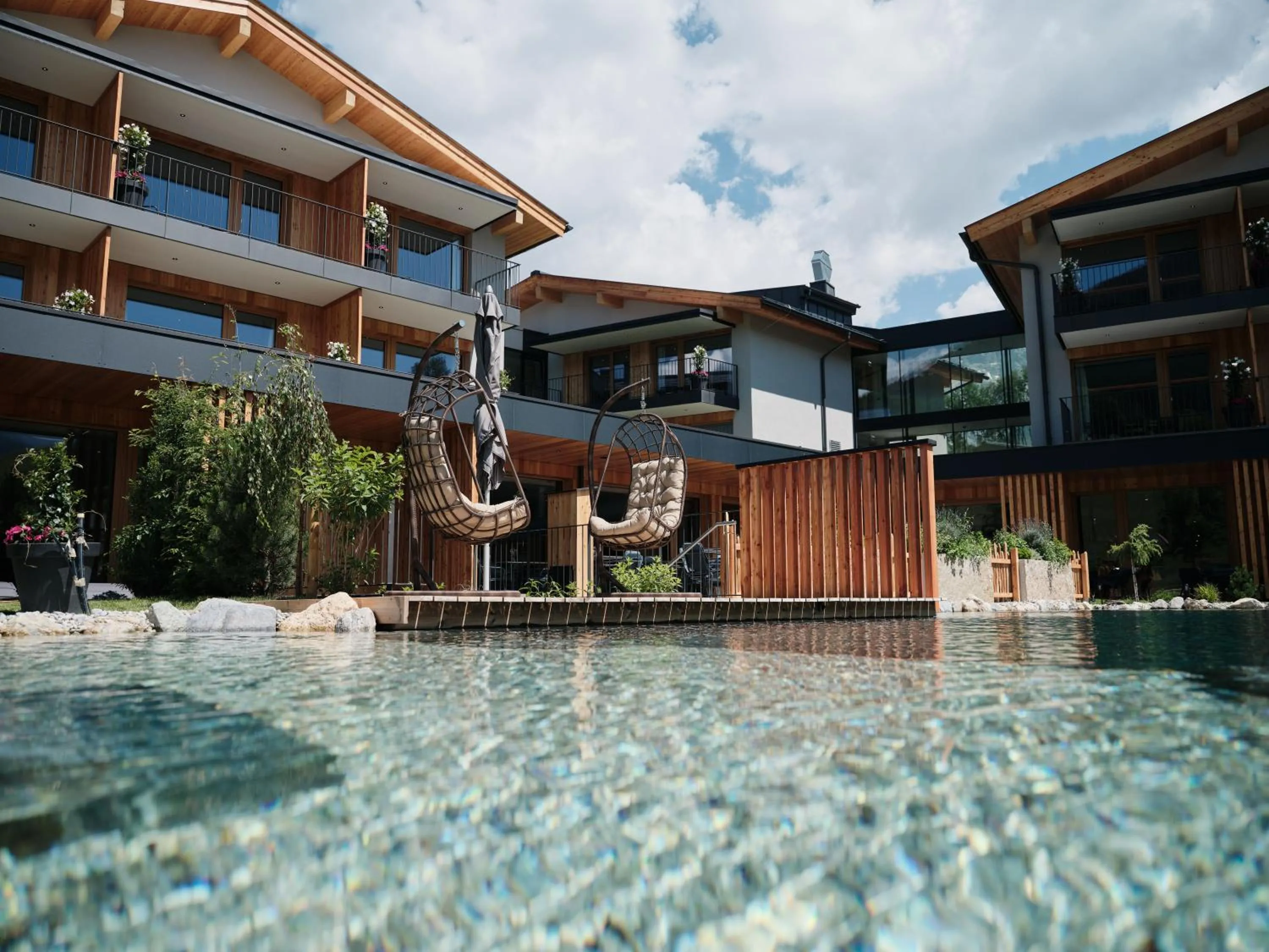 Spa and wellness centre/facilities in Wellness und Brunch Hotel MorgenZeit beheizter Naturpool mit Sandstrand Genuss Frühstück bis 13 Uhr Hochkönig Sommercard