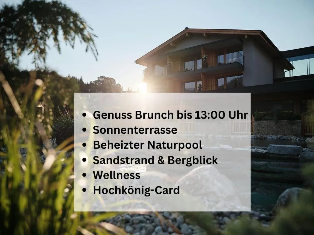 Property building in Wellness und Brunch Hotel MorgenZeit beheizter Naturpool mit Sandstrand Genuss Frühstück bis 13 Uhr Hochkönig Sommercard