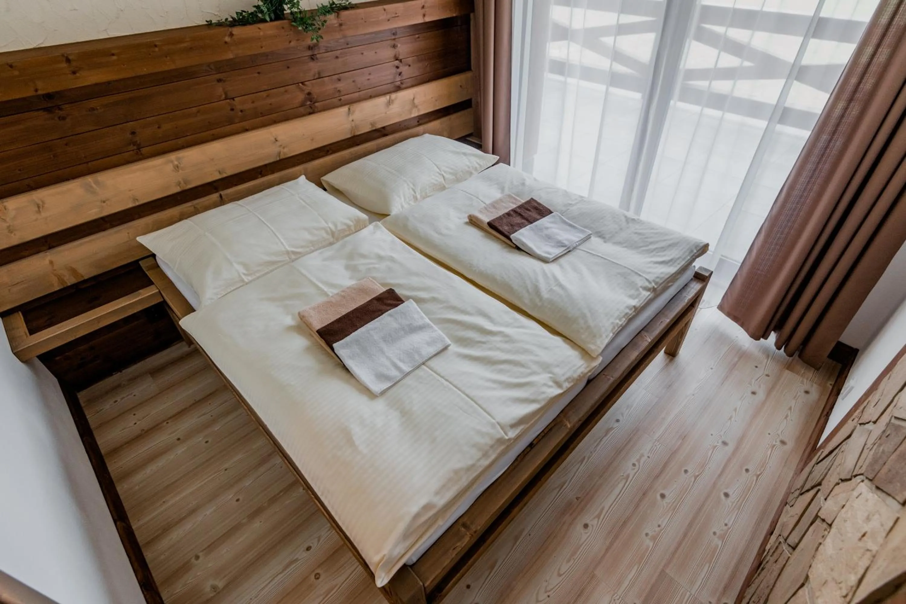 Bed in Nestville Apartments