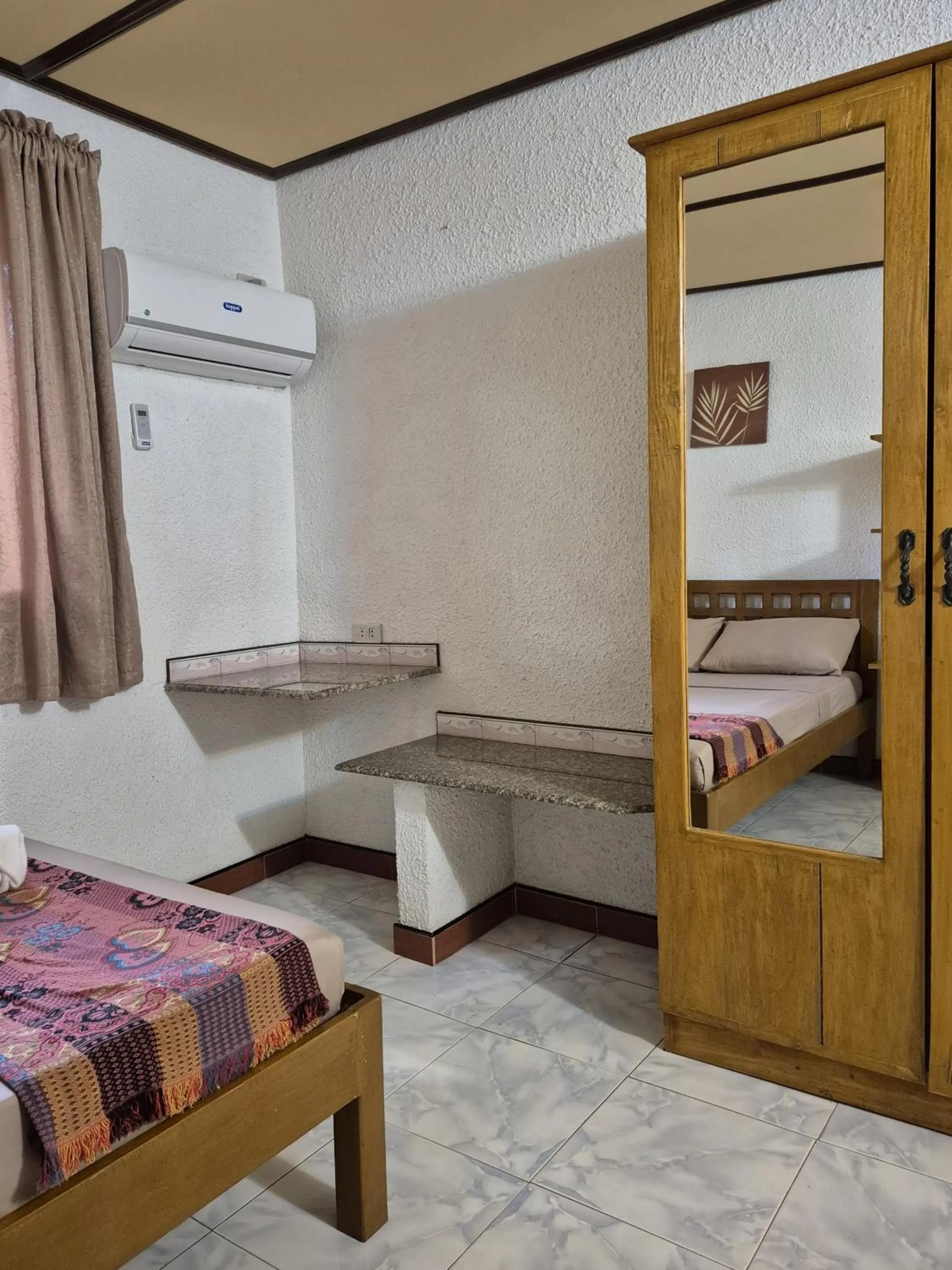 Bed in ALONALAND RESORT