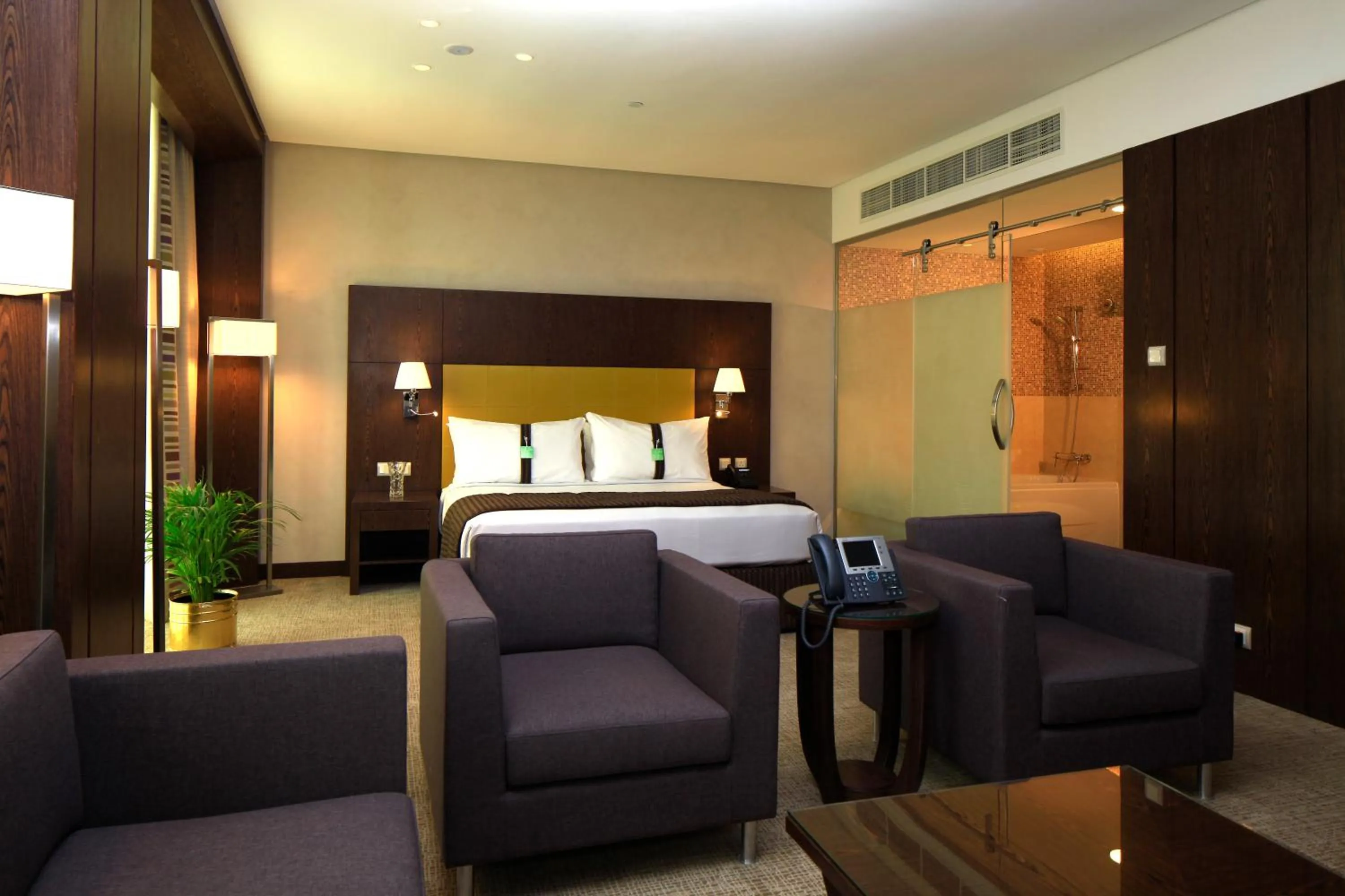 Seating area, Bed in Holiday Inn Meydan, an IHG Hotel