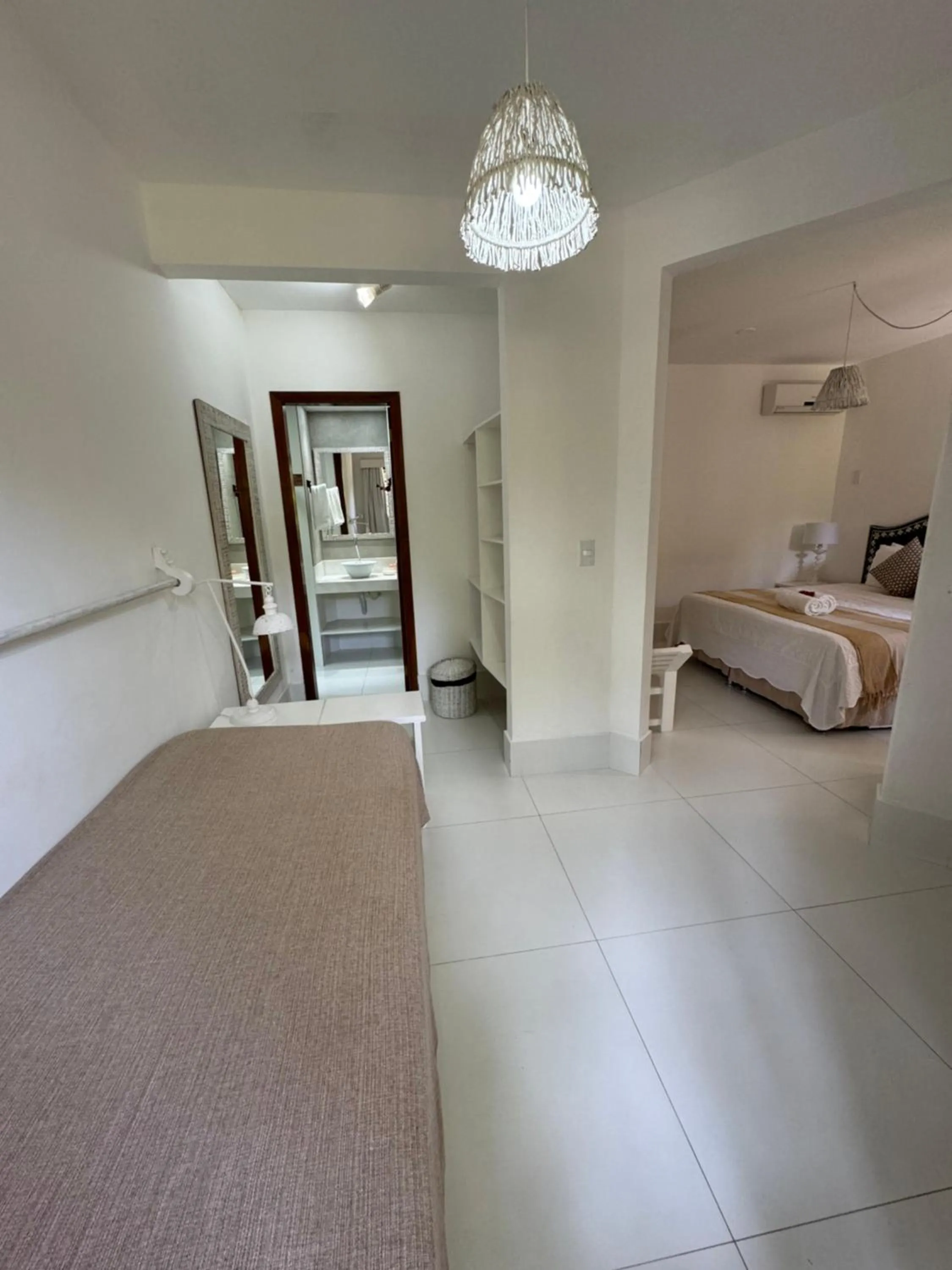 Bed in Pousada Coisa e Tao