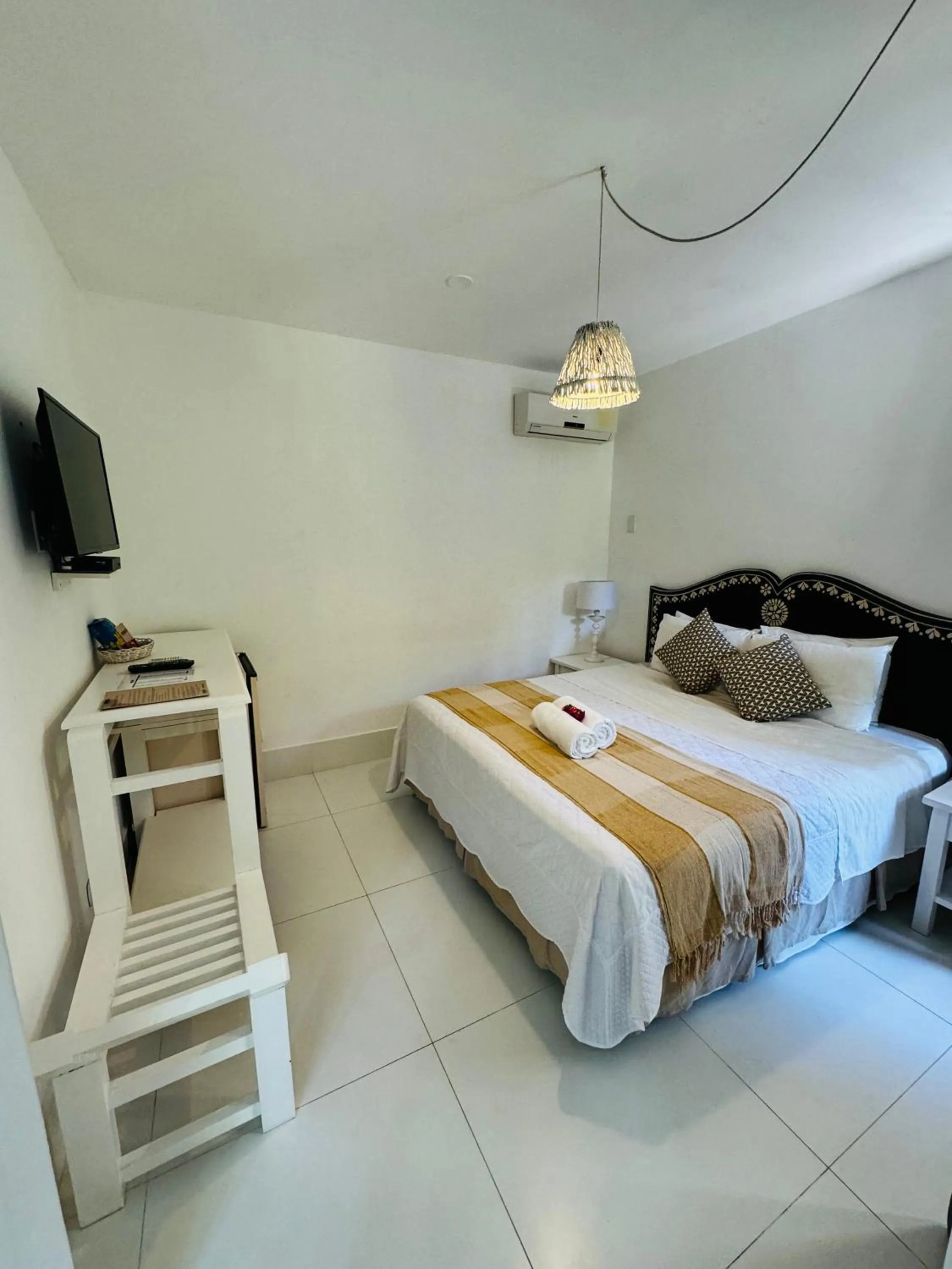 Bed in Pousada Coisa e Tao