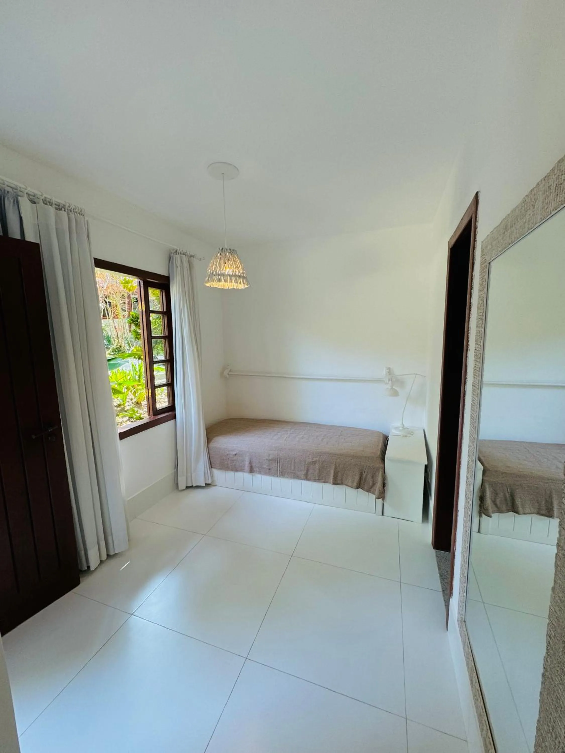 Bed in Pousada Coisa e Tao