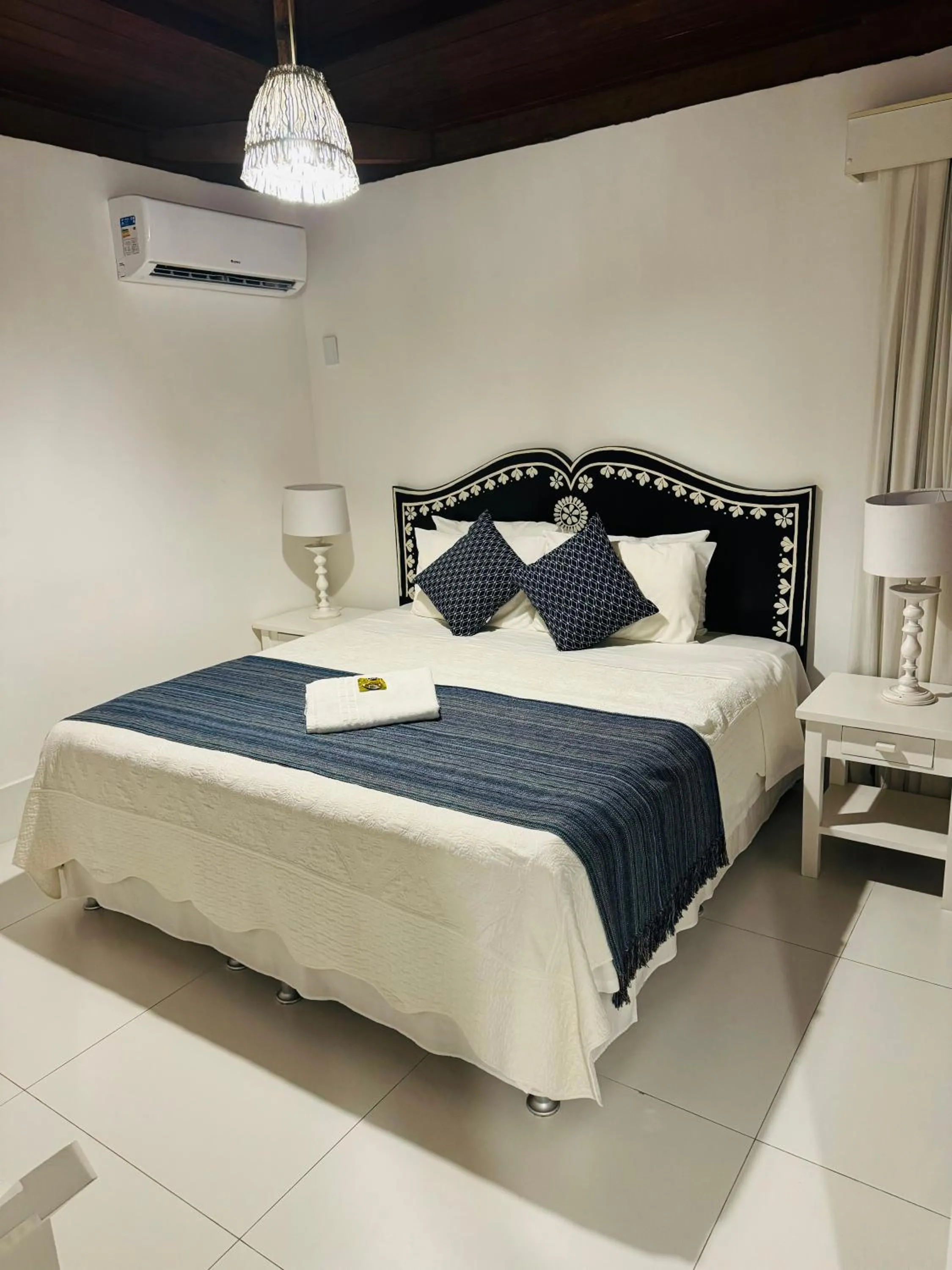 Bed in Pousada Coisa e Tao