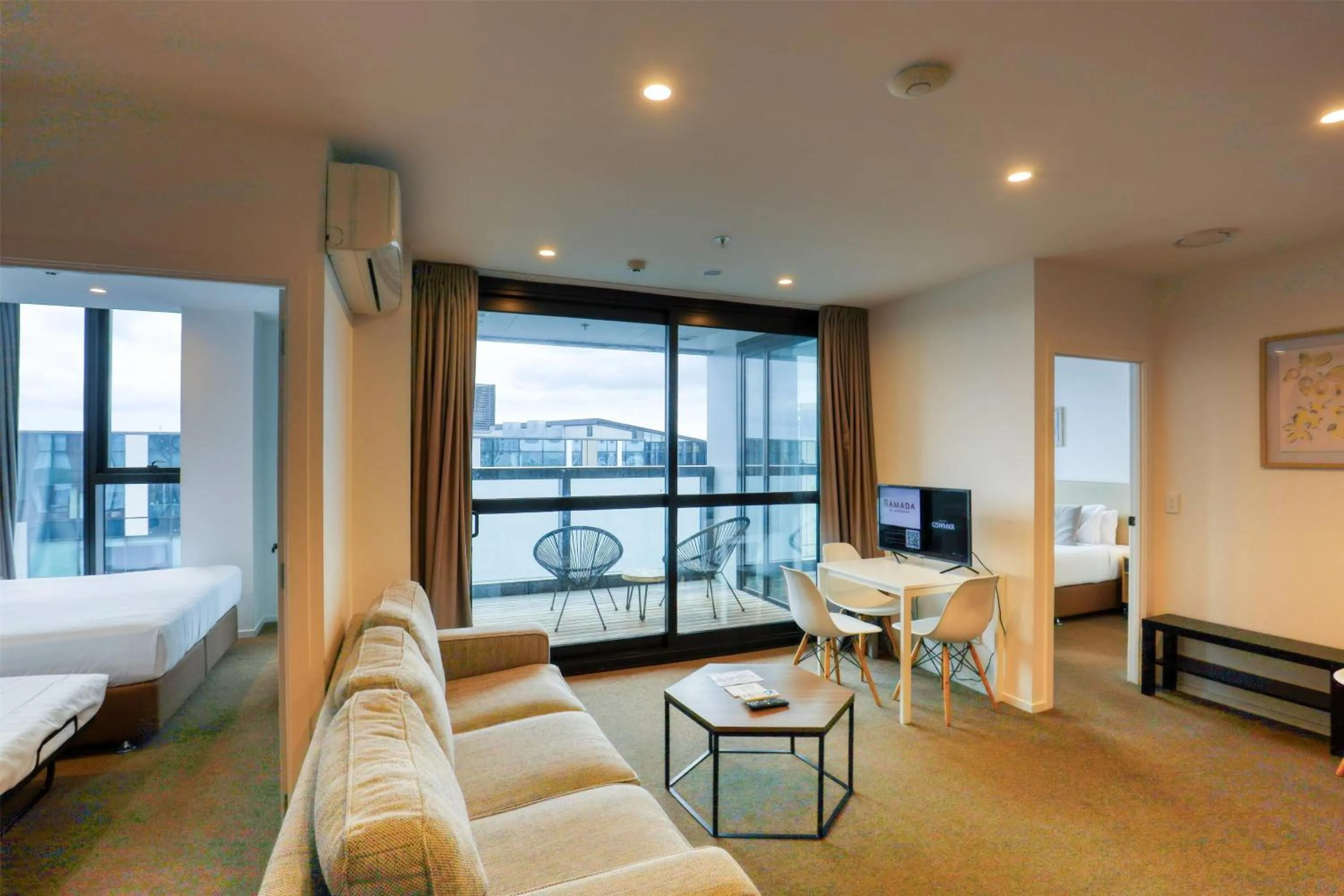 Photo of the whole room, Bed in Ramada Suites By Wyndham Victoria Street West