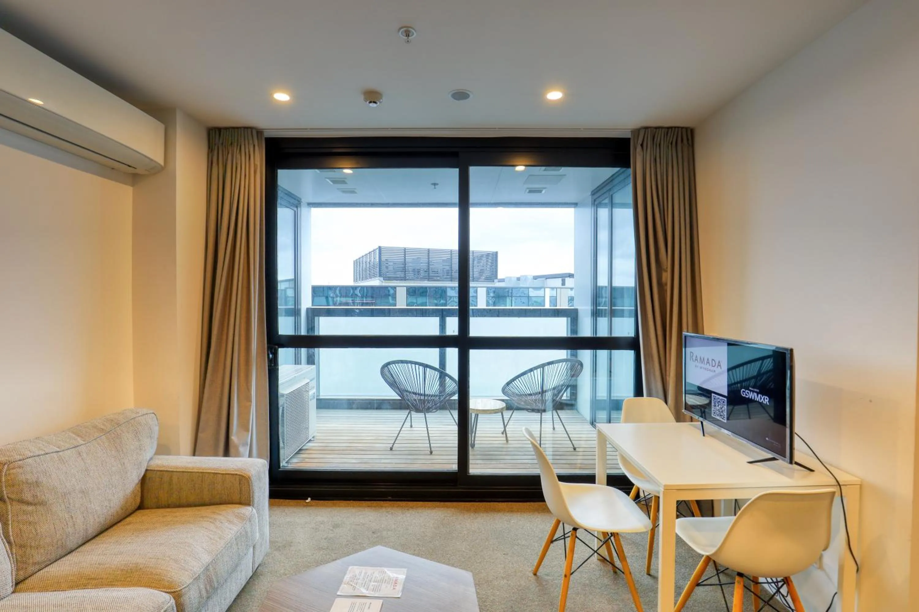 Living room in Ramada Suites By Wyndham Victoria Street West