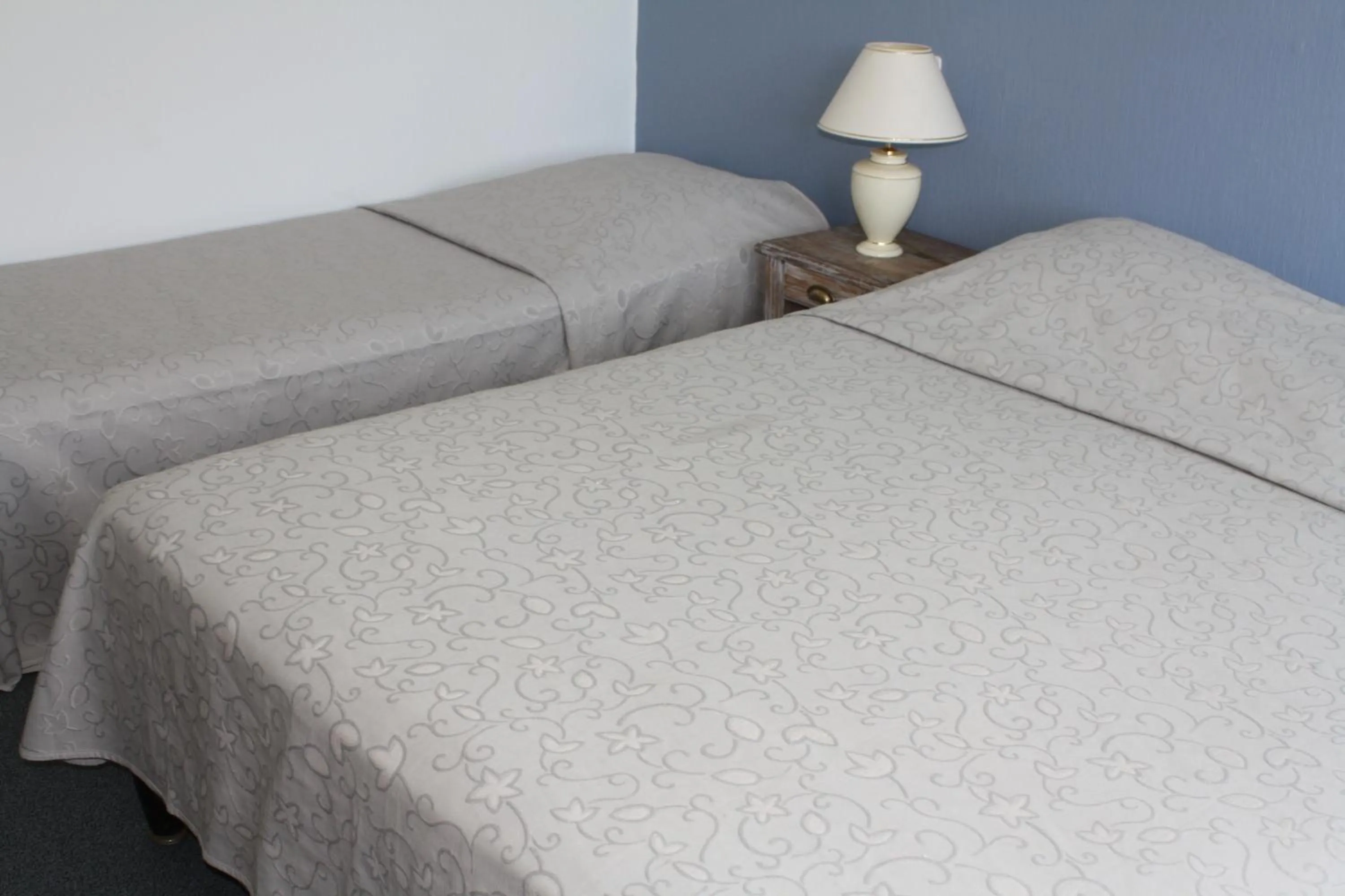 Bed in Logis Hotel du Midi