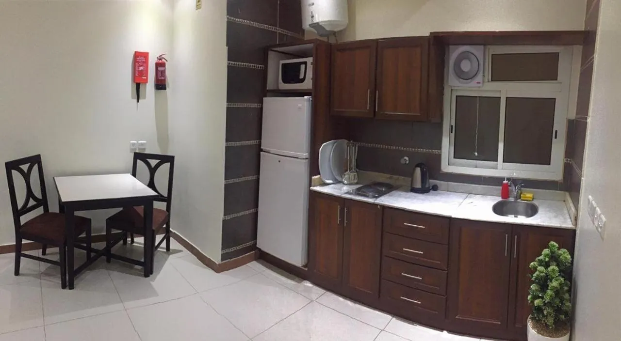 Kitchen or kitchenette in Merfal Hotel Apartments Al Taawan