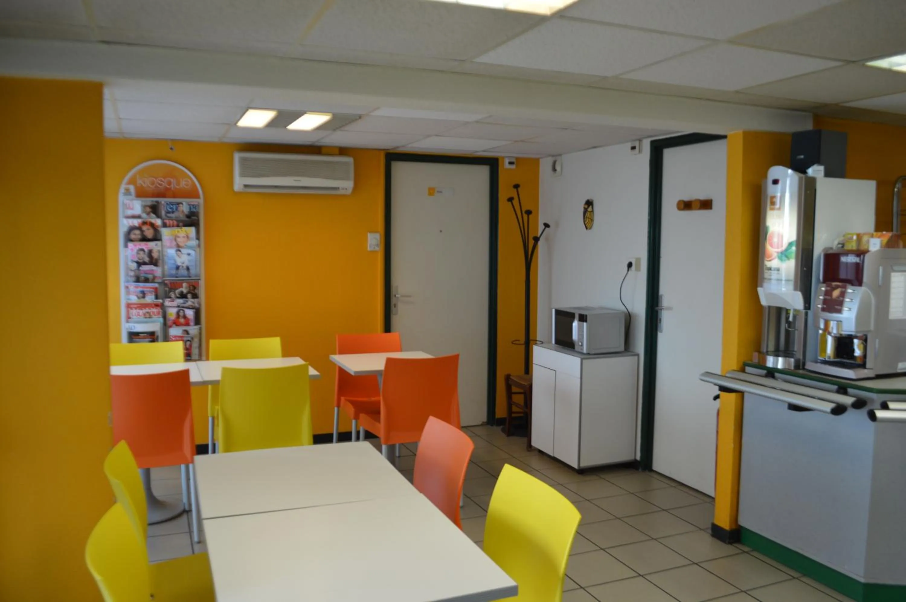 Communal lounge/ TV room in Premiere Classe Chambery