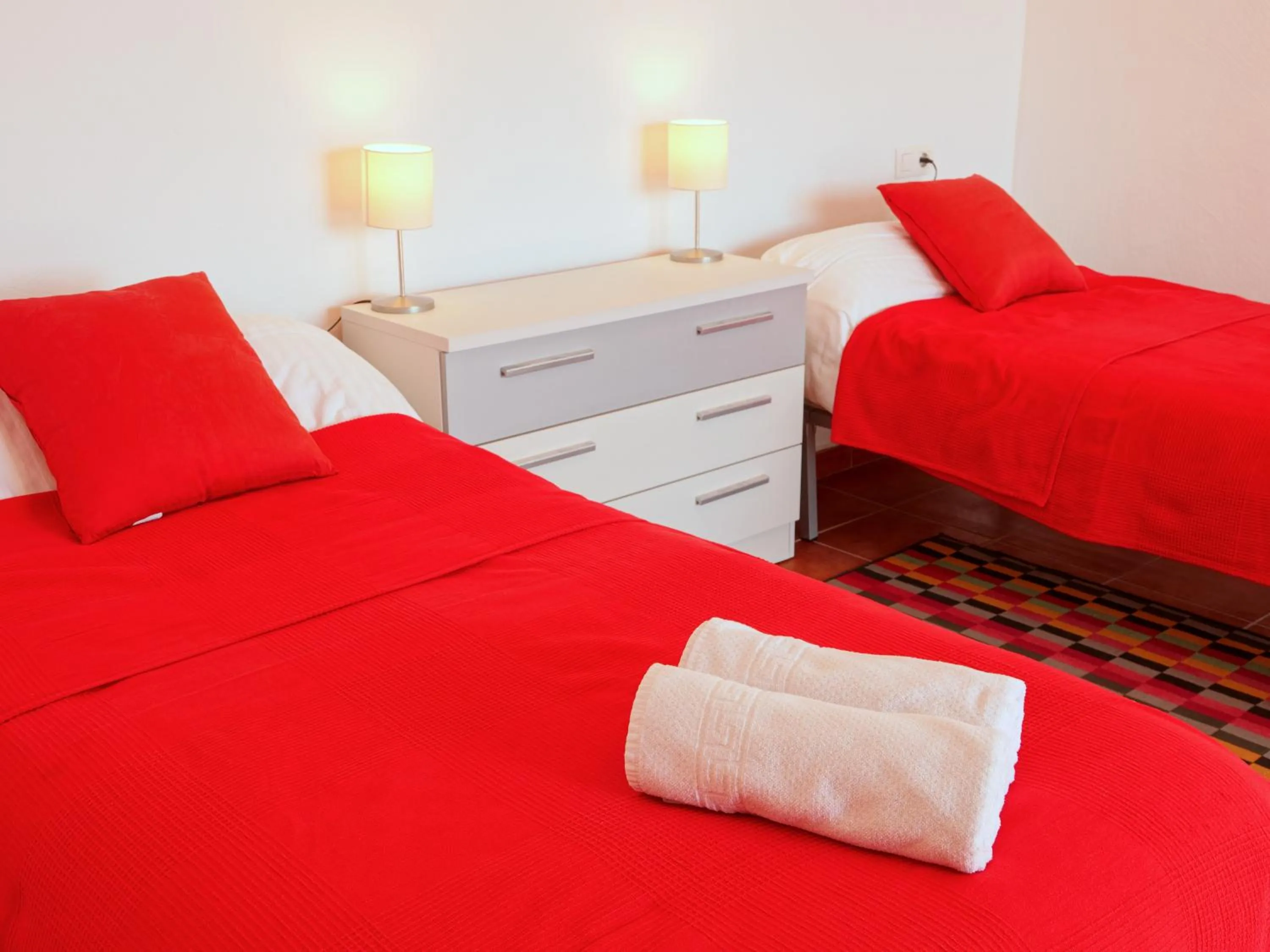 Bed in Casa Arts guest rooms