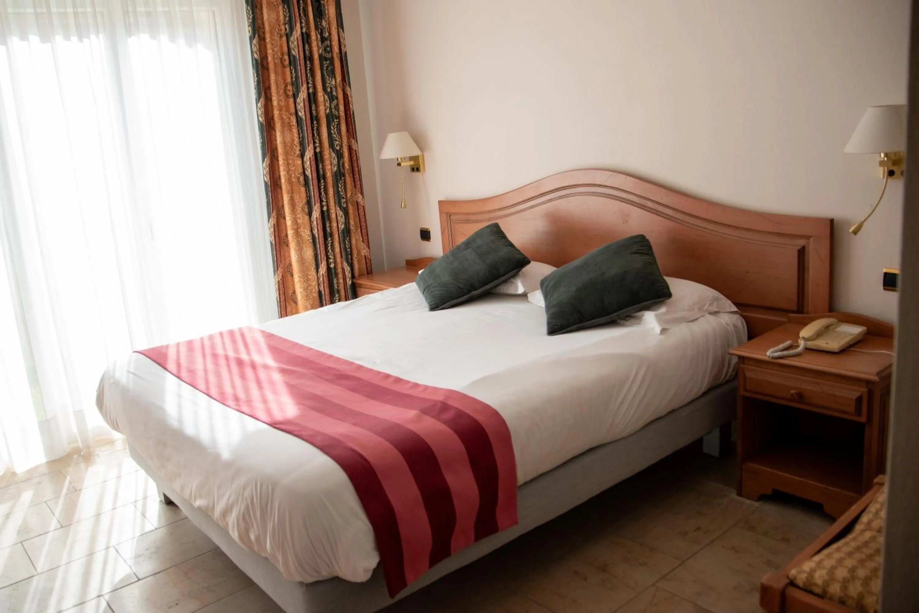 Bed in Logis Le Saint Nicolas