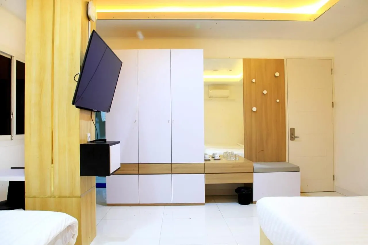 Communal lounge/ TV room, Bed in Arawa Traveller's Inn Motel