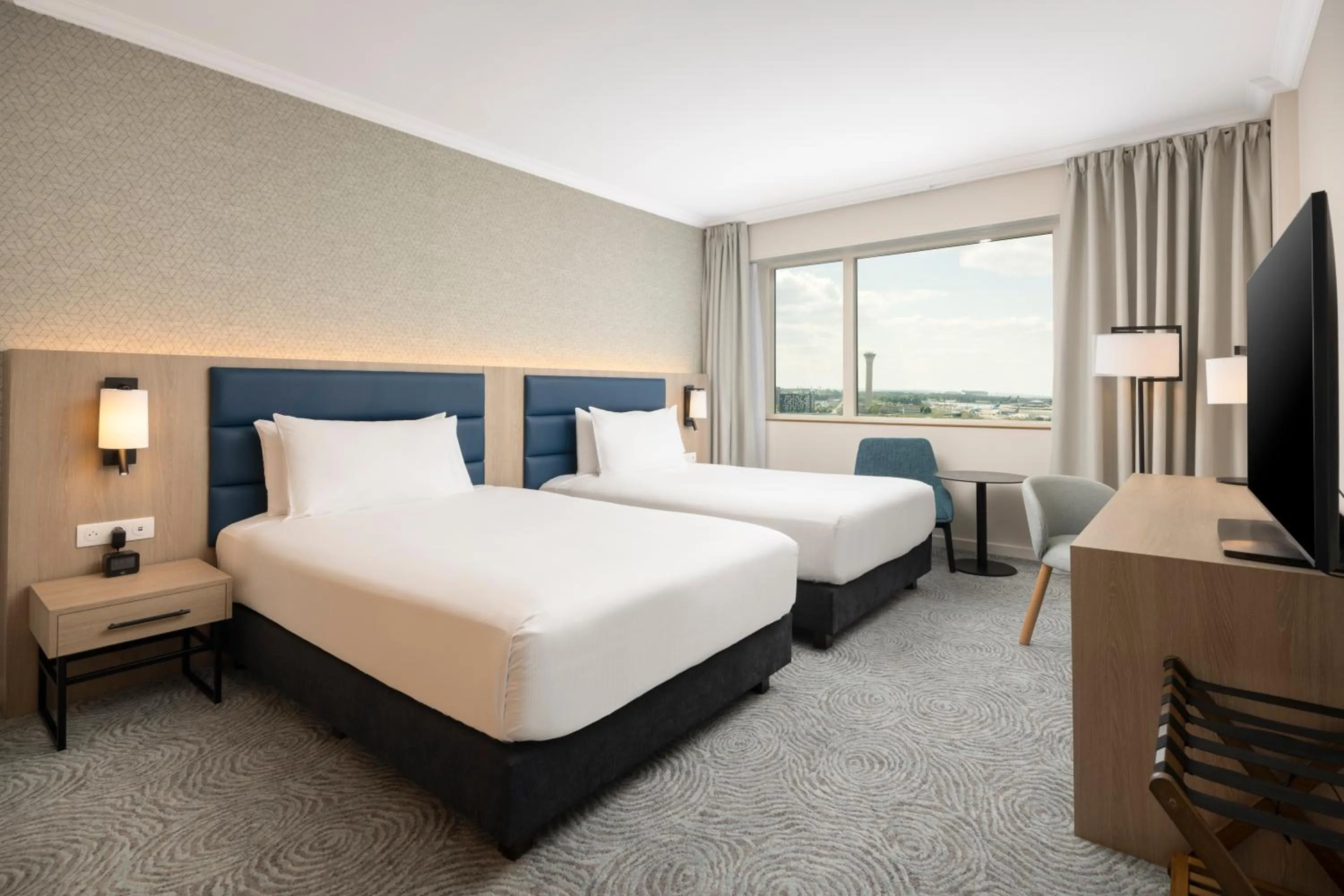 Photo of the whole room, Bed in Hilton Paris Charles De Gaulle Airport