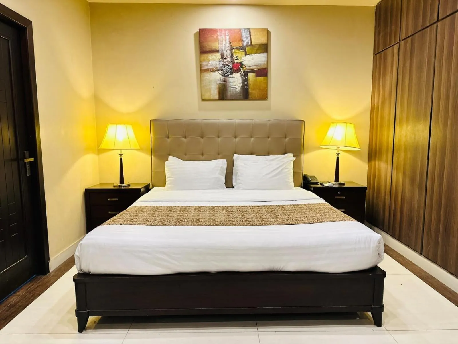 Bed in Grand Regent Hotel and Suites