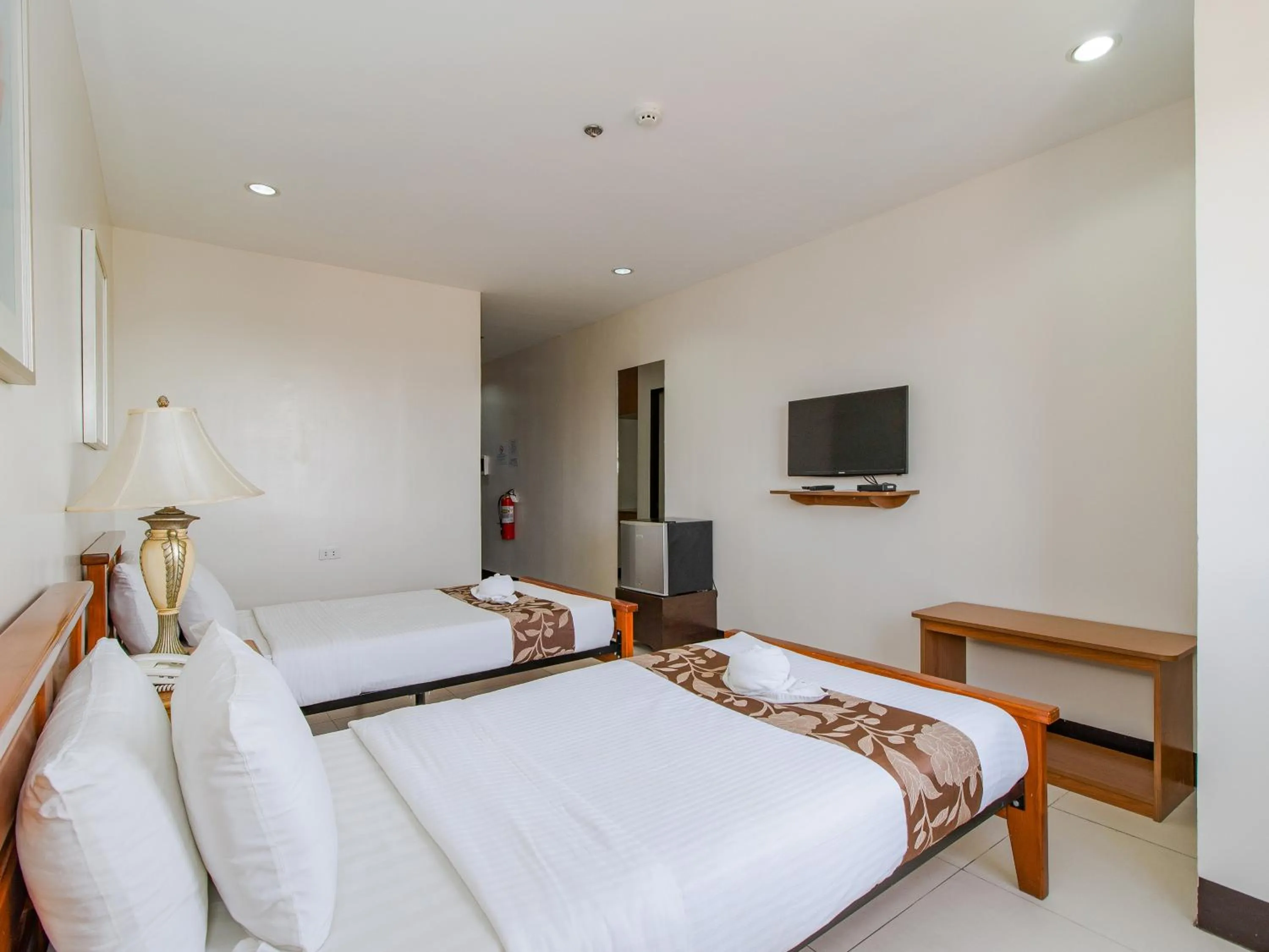 Bed in Main Hotel & Suites