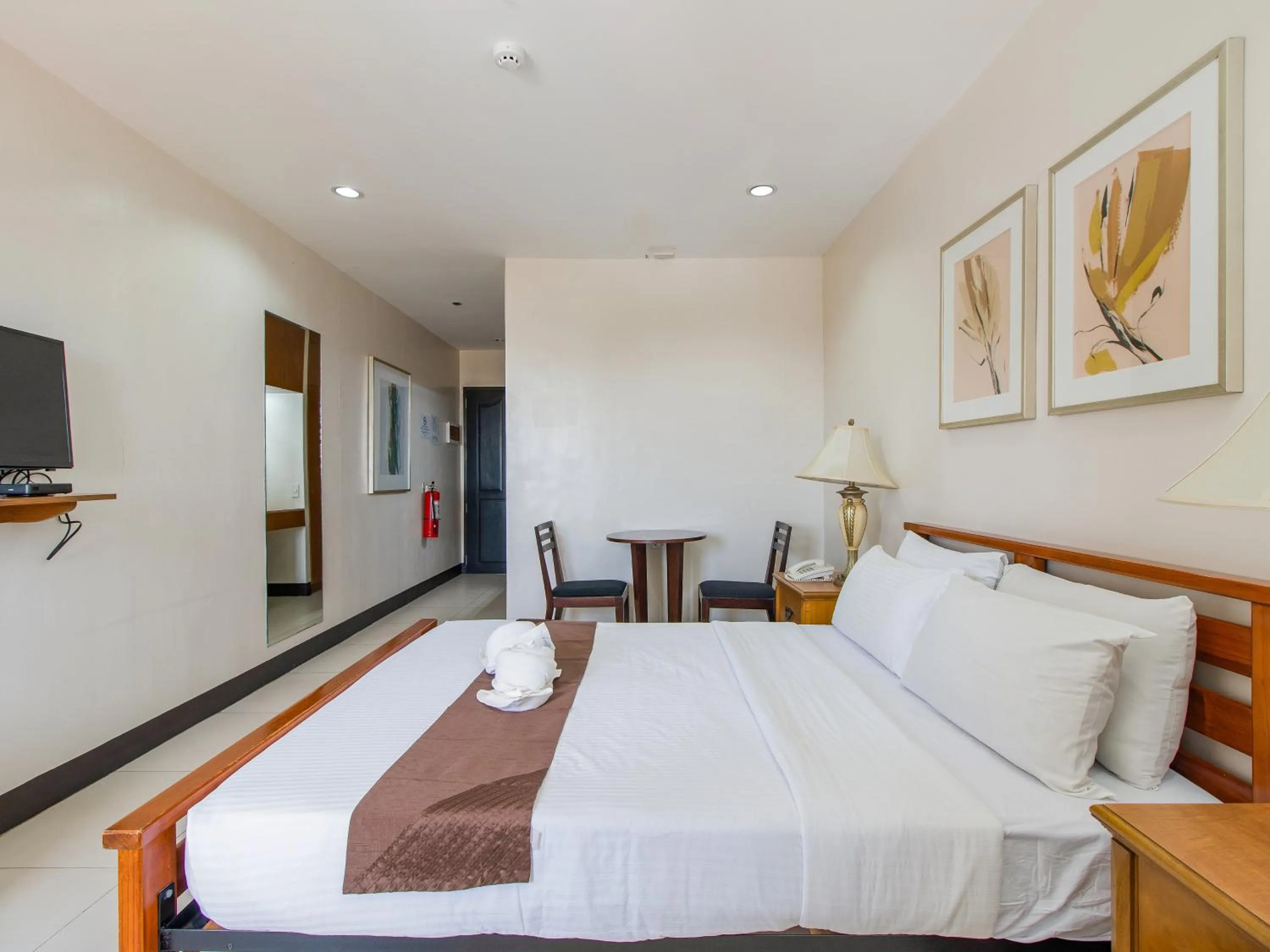 Bed in Main Hotel & Suites