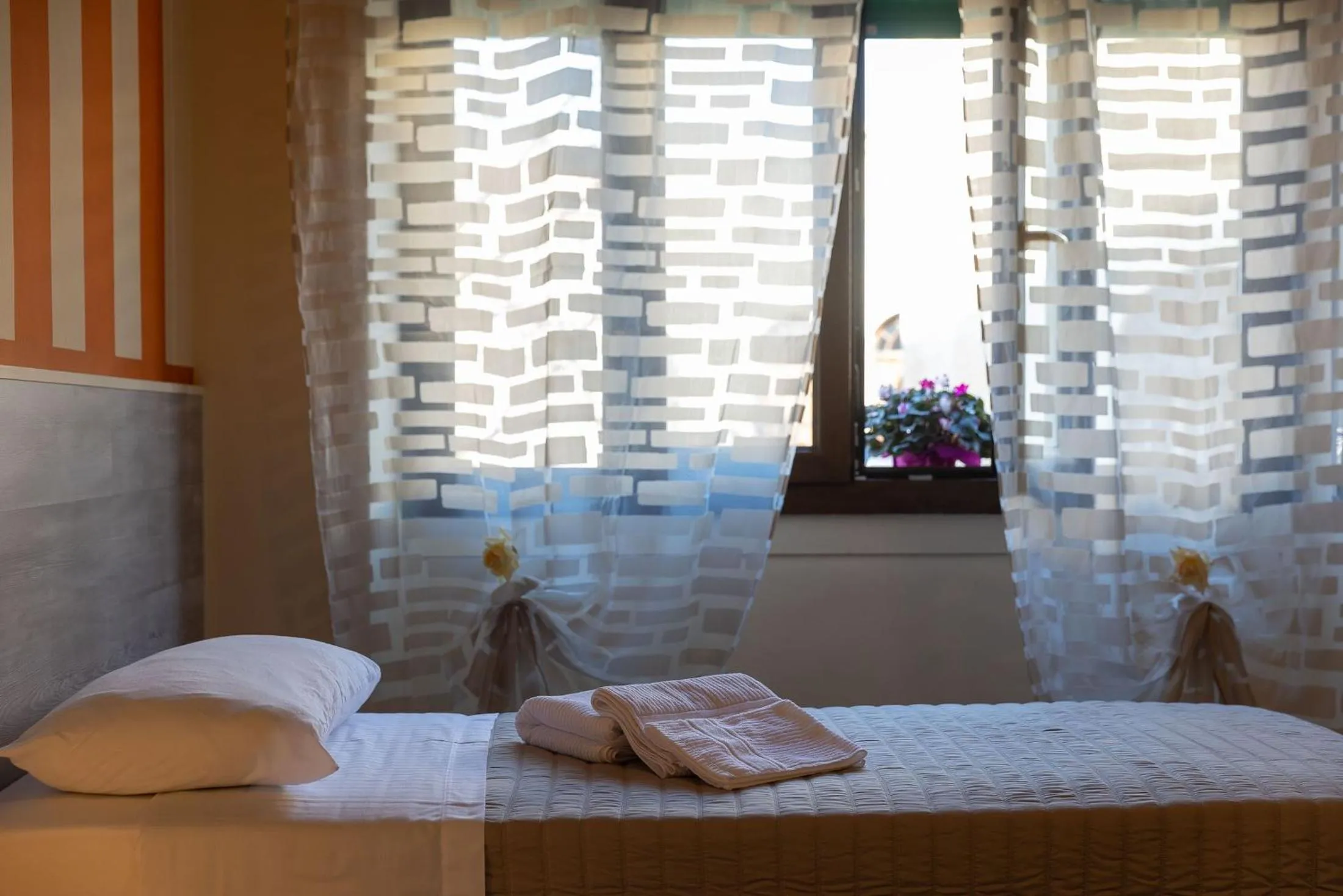 Bed in L'OPERA ROOMS