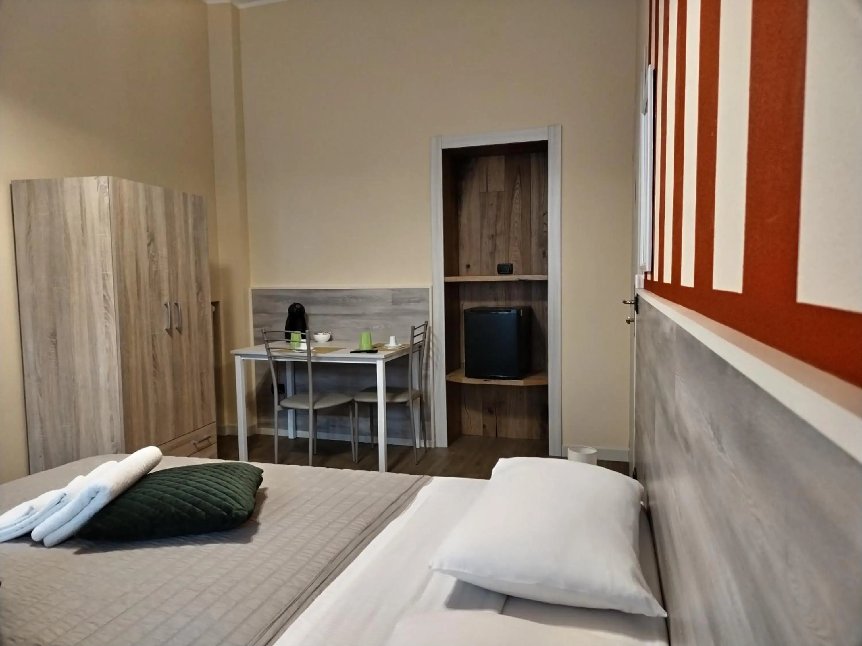 Bed in L'OPERA ROOMS