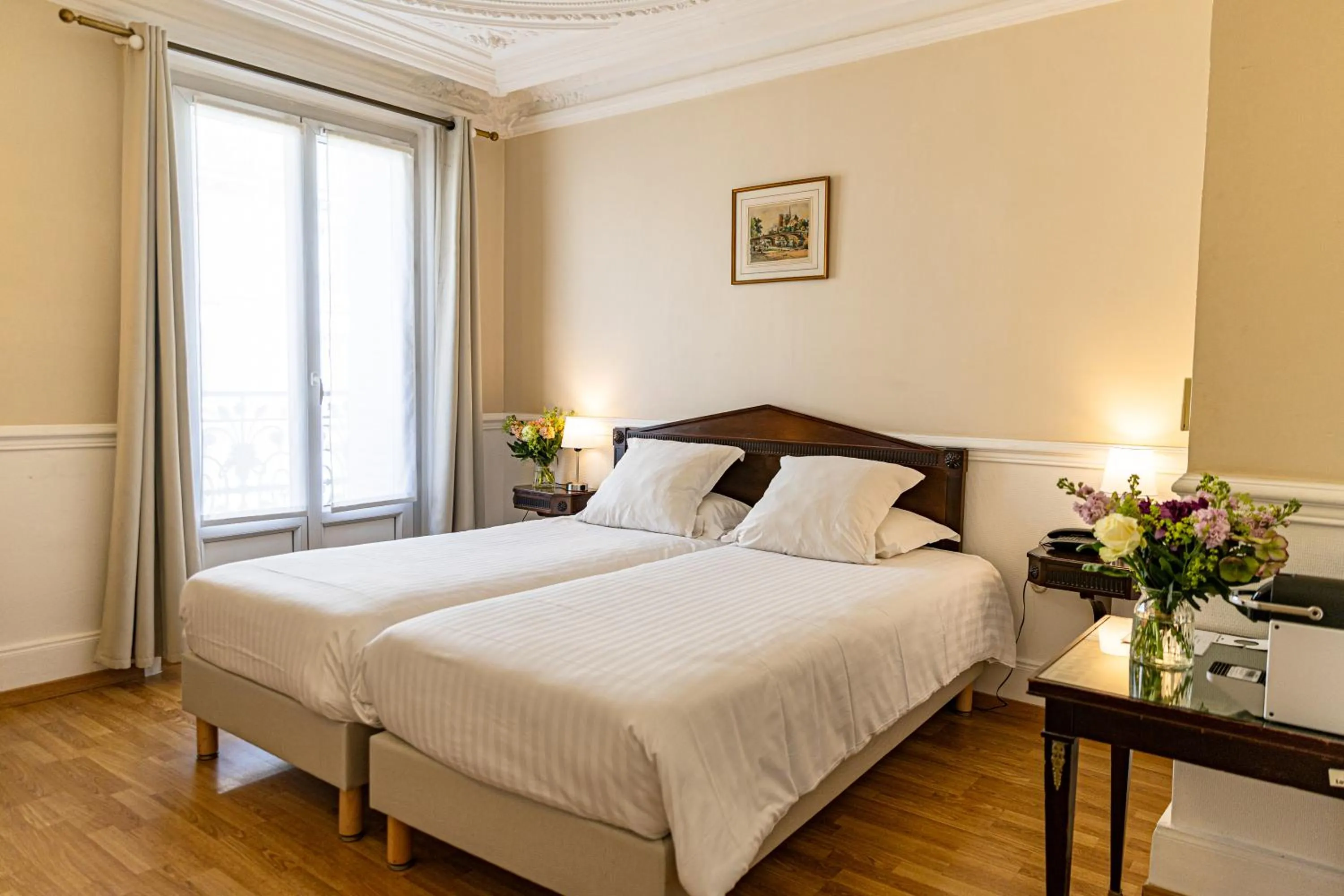 Bed in Hotel Claude Bernard Saint-Germain