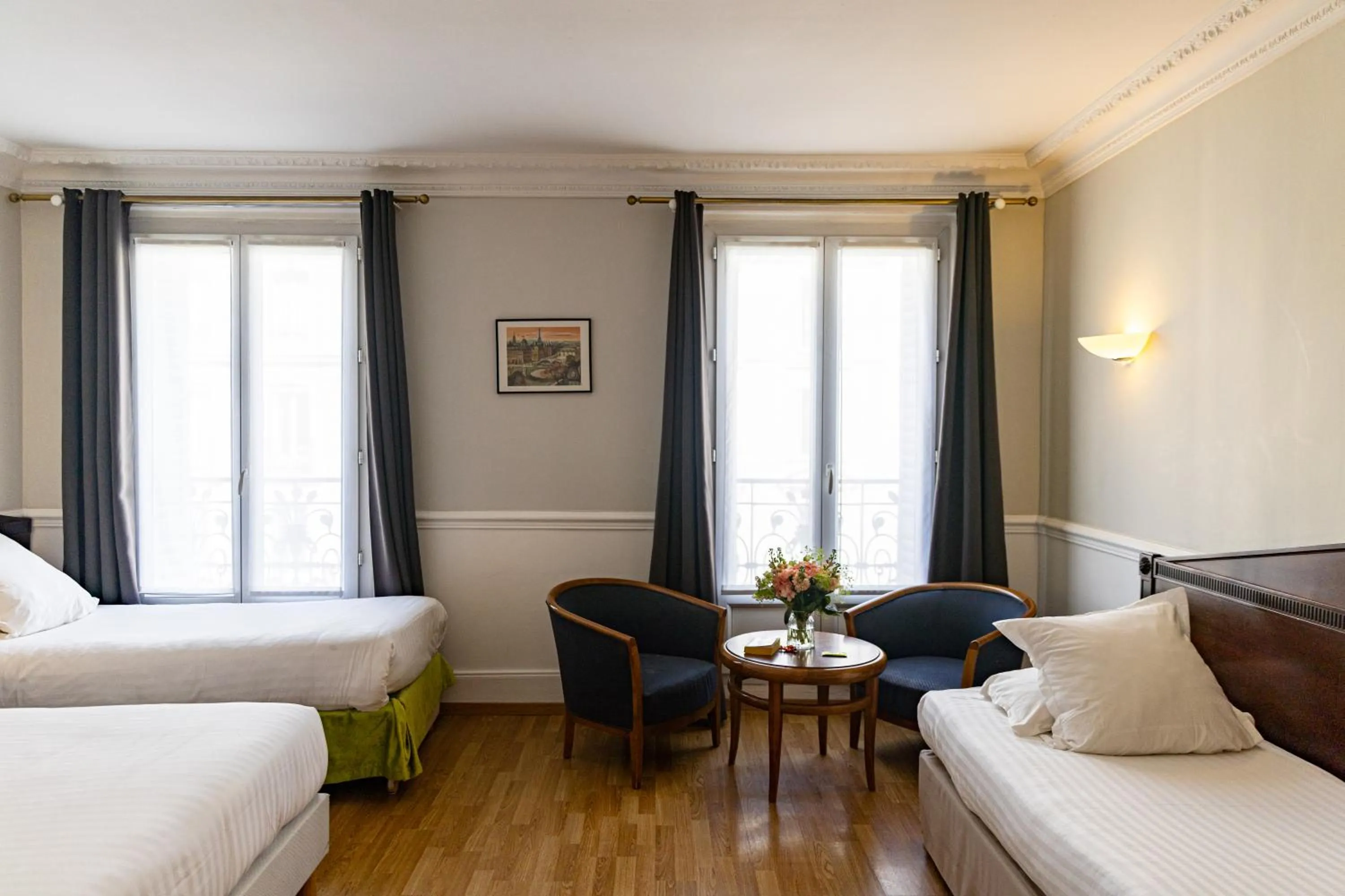 Bed in Hotel Claude Bernard Saint-Germain