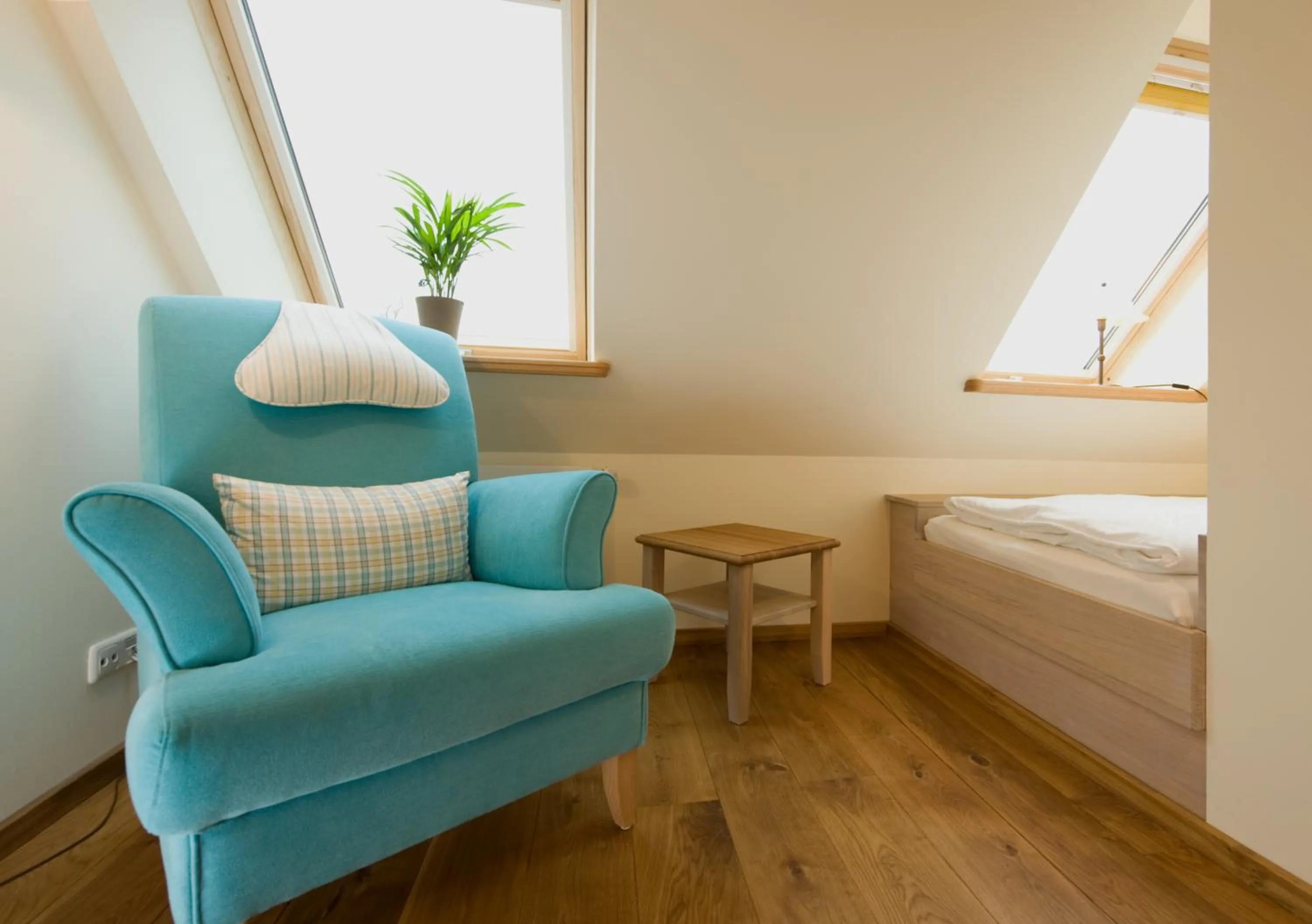 Seating area, Bed in Hotel Gutshaus Parin - Bio- und Gesundheitshotel