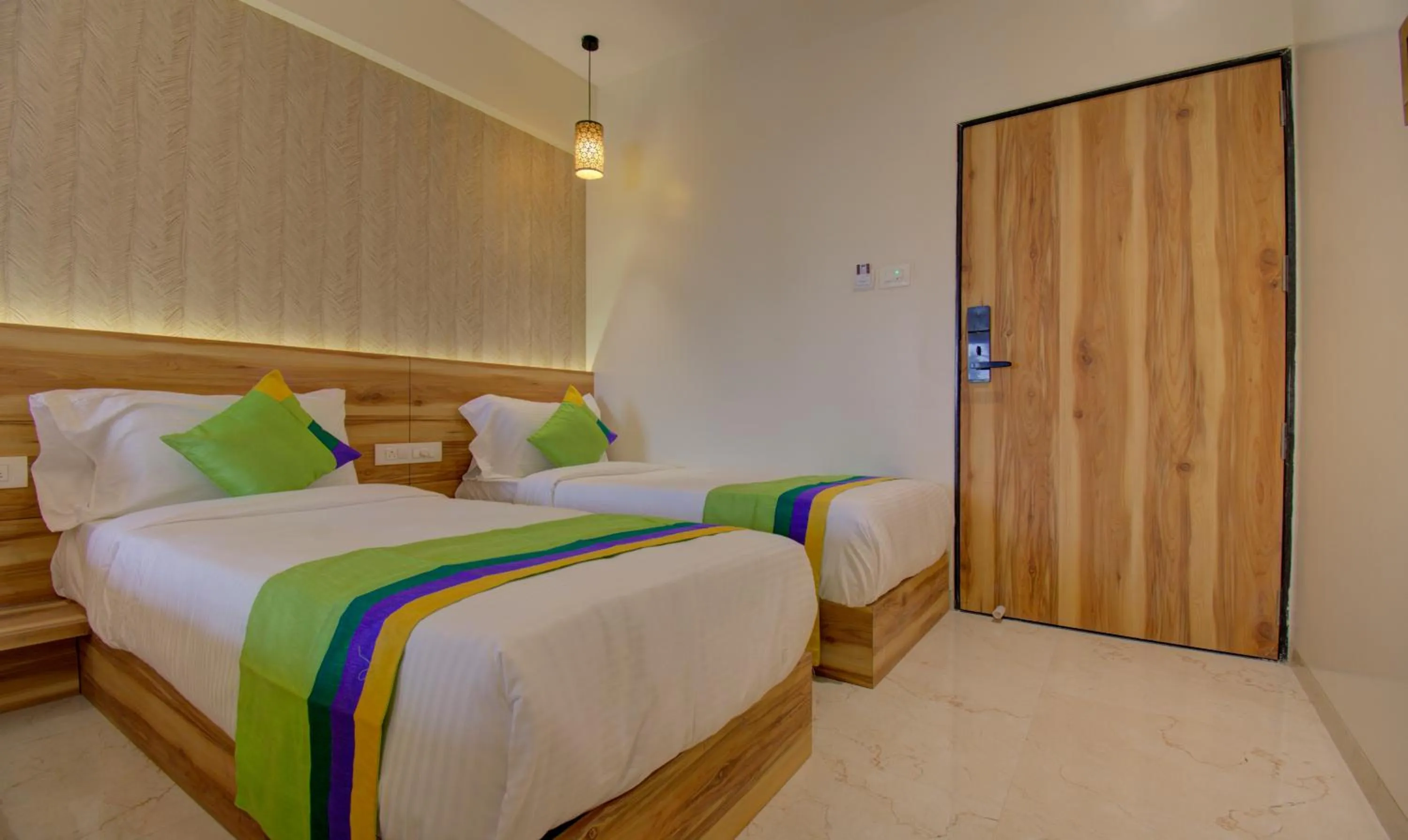 Bed in Hotel Amisha International