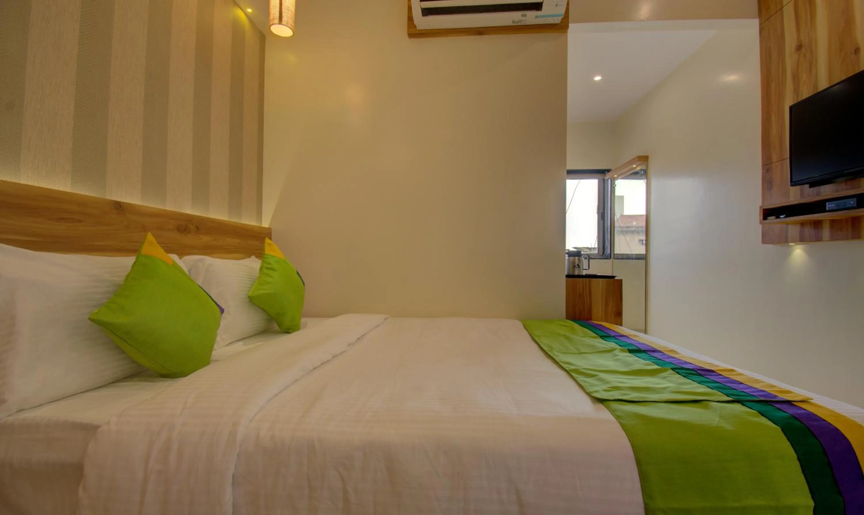 Bed in Hotel Amisha International