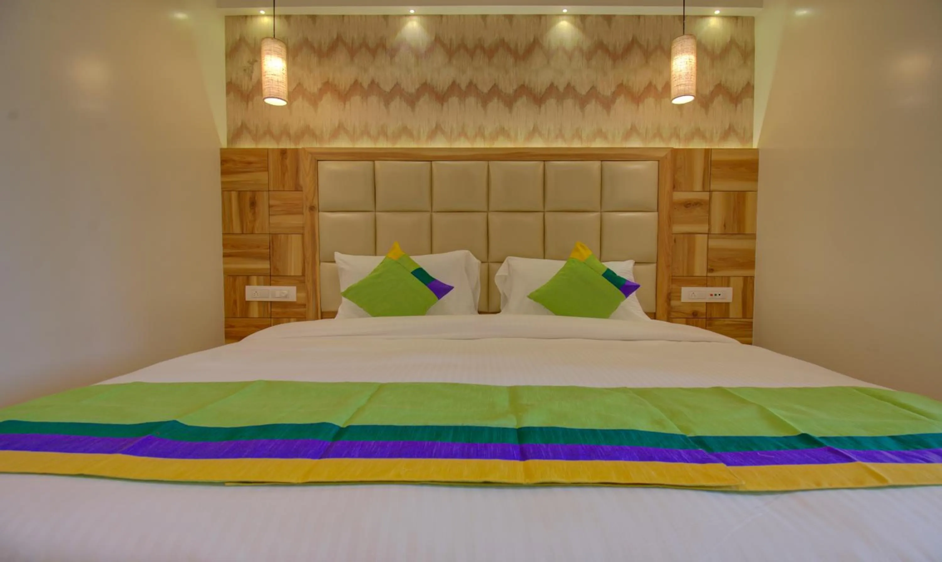 Bed in Hotel Amisha International