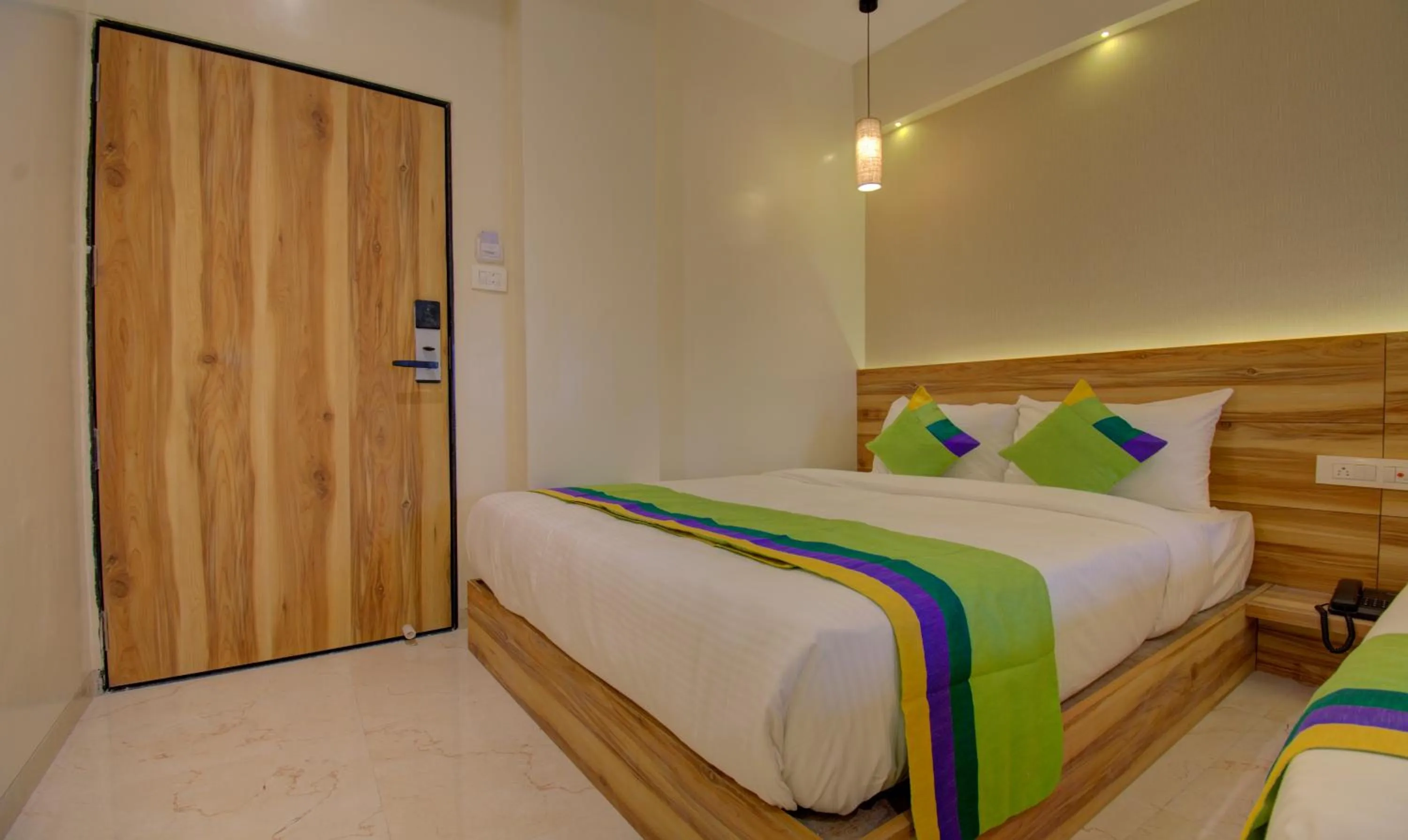 Bed in Hotel Amisha International