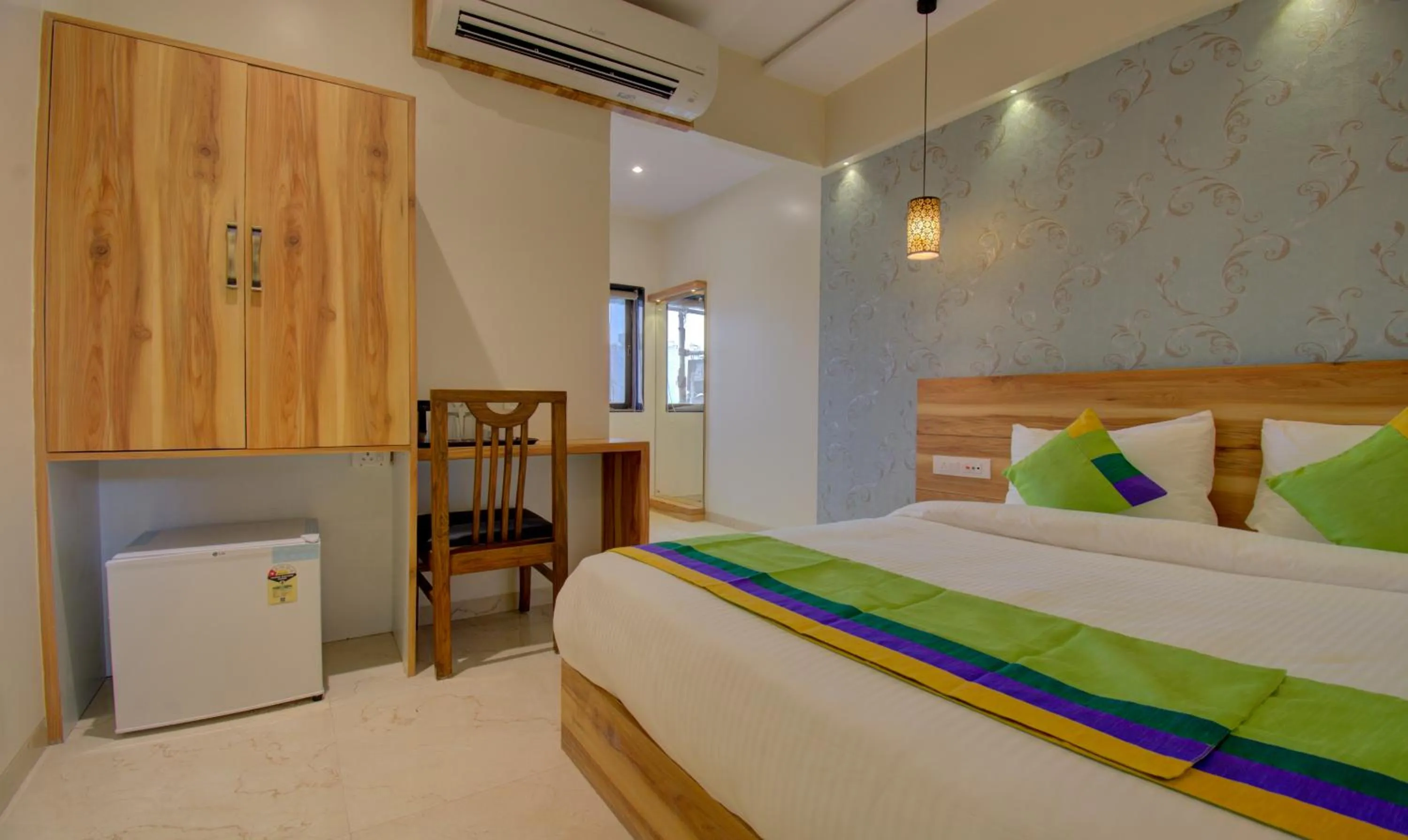 Bed in Hotel Amisha International