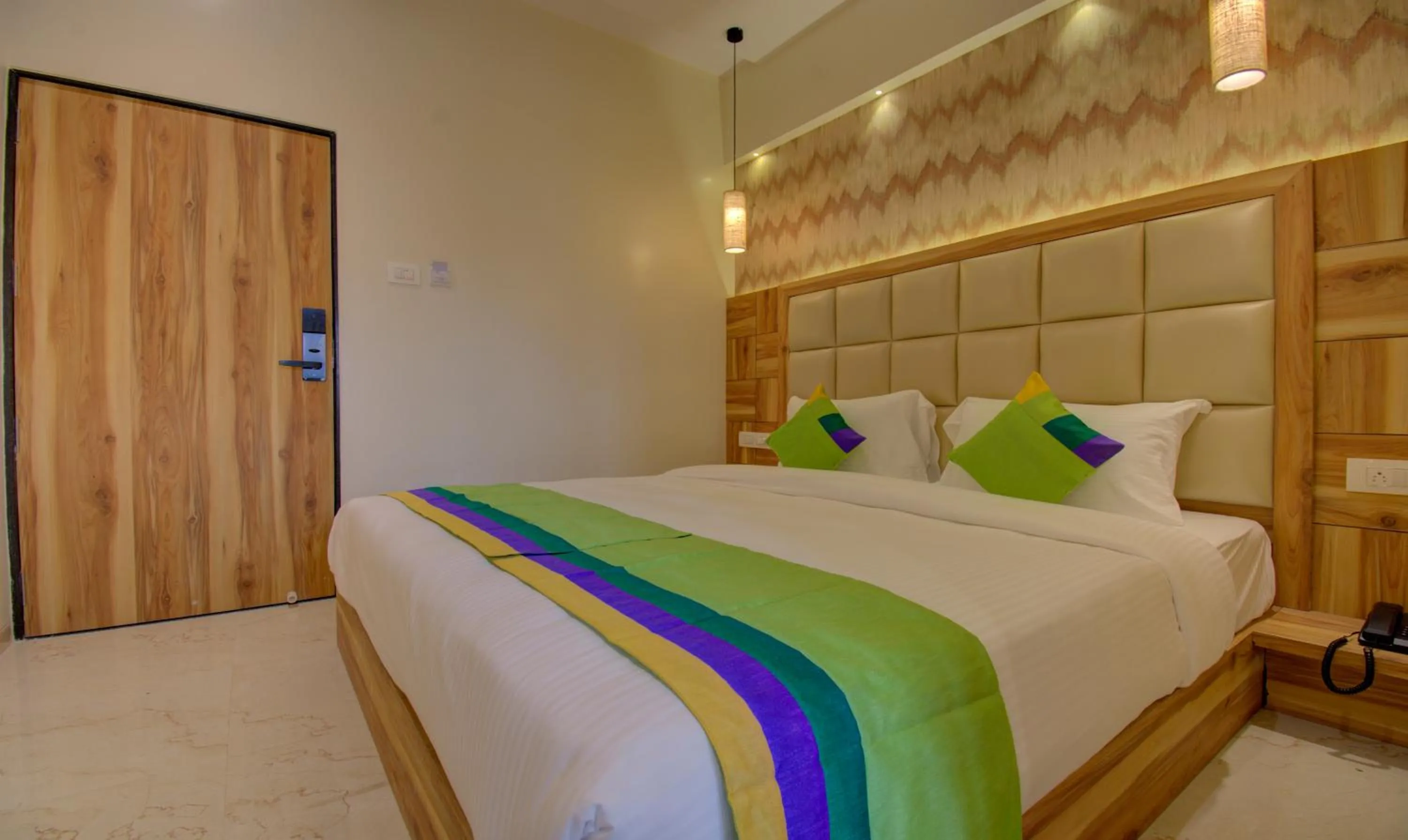 Bed in Hotel Amisha International