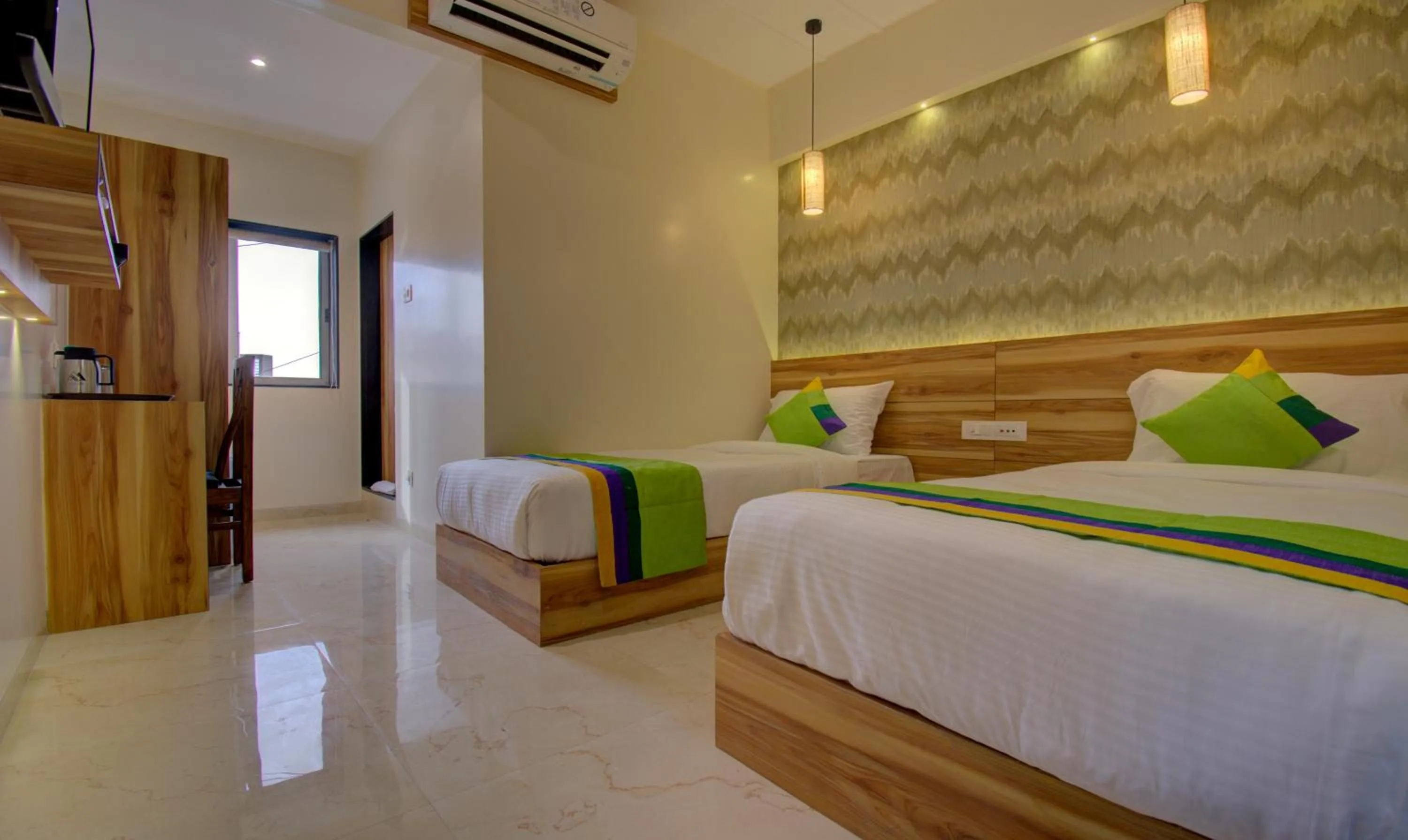 Bed in Hotel Amisha International